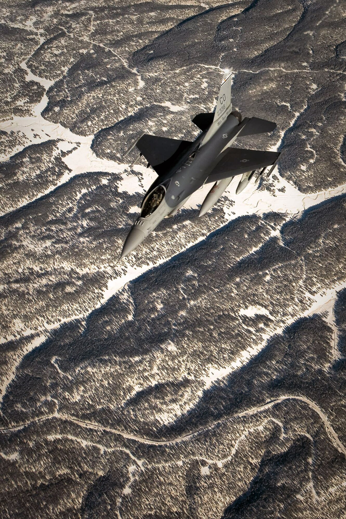 An F-16 Fighting Falcon prepares to get into position to receive fuel from a KC-135 Stratotanker Dec. 1 over the Southwestern United States. The F-16 was en route to Barksdale Air Force Base, La., to take part in Green Flag East, a pre-deployment exercise for Air Combat Command flying units that perform close-air support and precision-guided munitions delivery. The F-16 is from the 120th Fighter Squadron of the Colorado Air National Guard. (U.S. Air Force photo/Master Sgt. John Nimmo Sr.) 