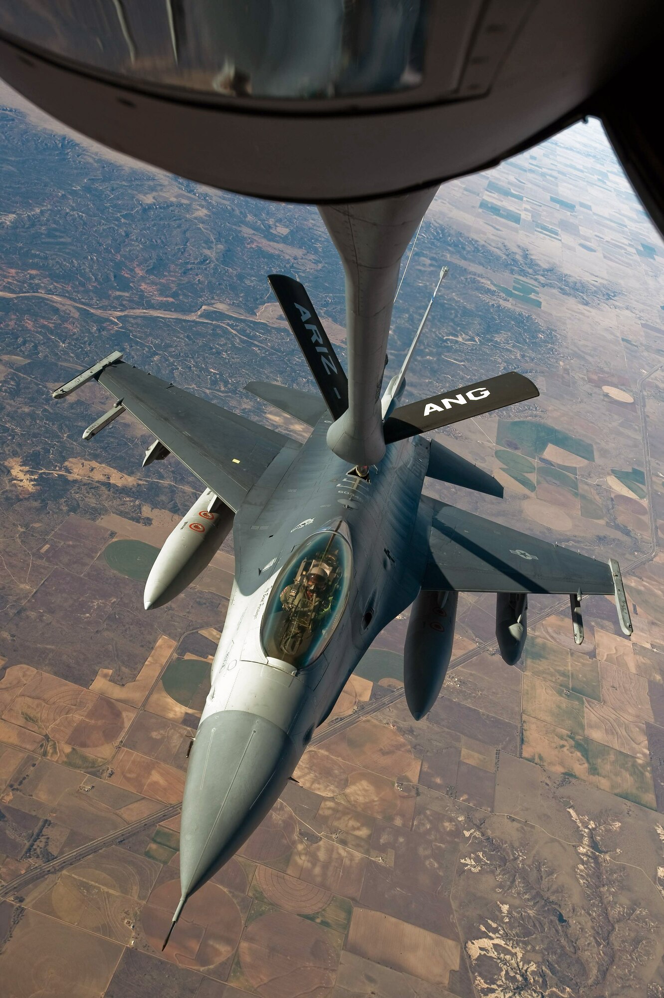 An F-16 Fighting Falcon receives fuel from a KC-135 Stratotanker Dec. 1 en route to Barksdale Air Force Base, La., to take part in Exercise Green Flag East. The exercise is a pre-deployment exercise for Air Combat Command flying units that perform close-air support and precision-guided munitions delivery. The F-16 is from the 120th Fighter Squadron of the Colorado Air National Guard. (U.S. Air Force photo/Master Sgt. John Nimmo Sr.) 
