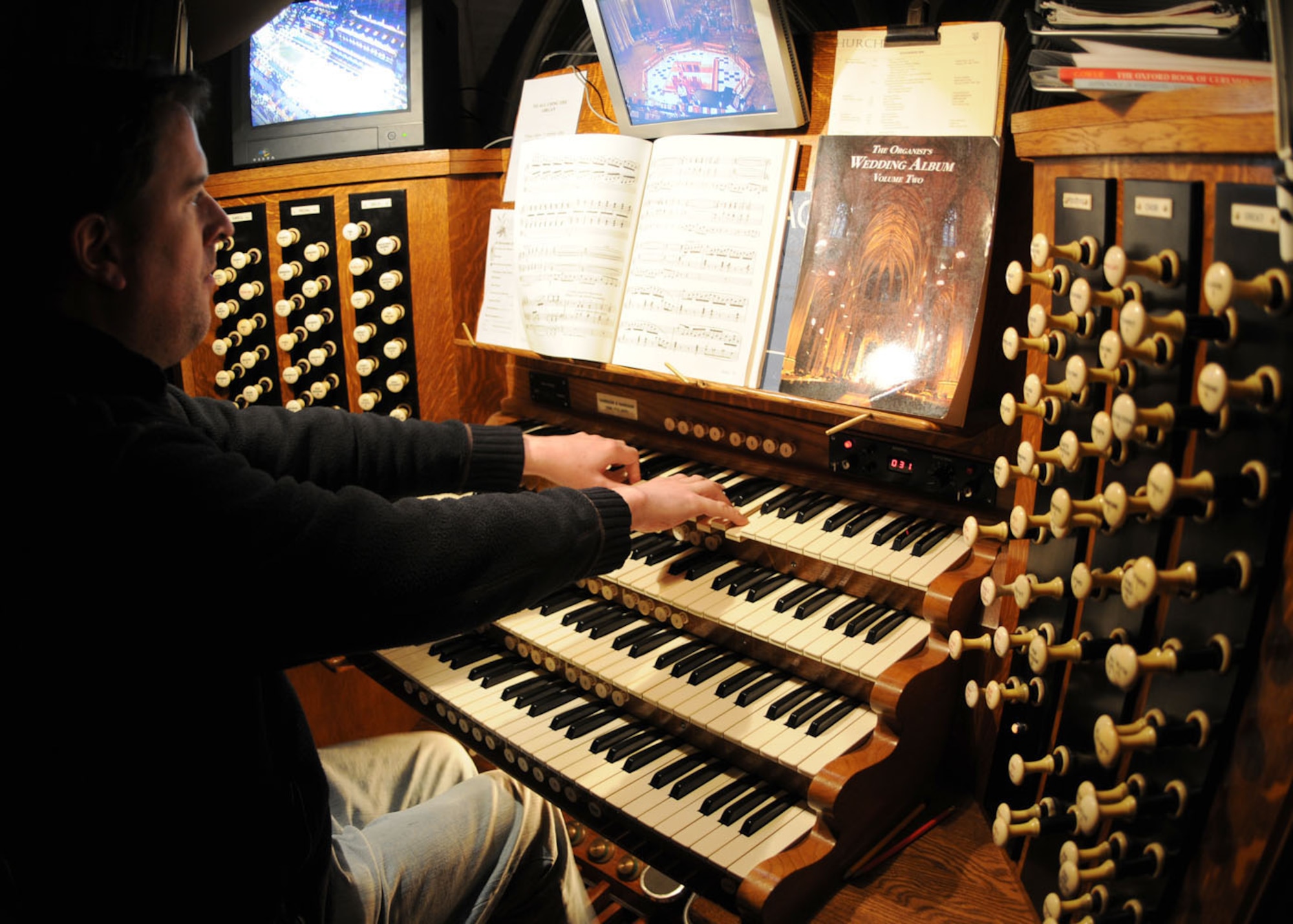 Johnathan Lilley provided the service with beautiful music from a 100-year-old Harrison organ during the Thanksgiving service held at the Ely Cathedral Nov. 26, 2008, in Ely, England. Mr. Lilley has been playing the organ for the church every day for nearly six years. (U.S. Air Force photo by Staff Sgt. Jerry Fleshman)