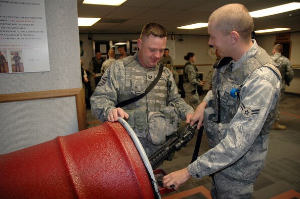 Airman 1st Class David Wilson, 741st Missile Security Forces member, clears an M-4 carbine under the supervision of Tech. Sgt. William Durrence, 741st MSFS member, Nov. 25. (U.S. Air Force photo/Senior Airman Dillon White) 