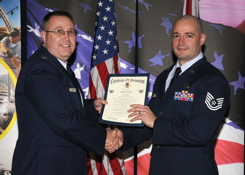 Staff Sgt. Phillip Addy is promoted to the rank of technical sergeant by Lt. Col. Dean R. Judge, the 352nd Maintenance Squadron commander, during the promotion ceremony held at the Galaxy Club Nov. 26, 2008, in RAF Mildenhall, England. (U.S. Air Force photo by Staff Sgt. Jerry Fleshman)