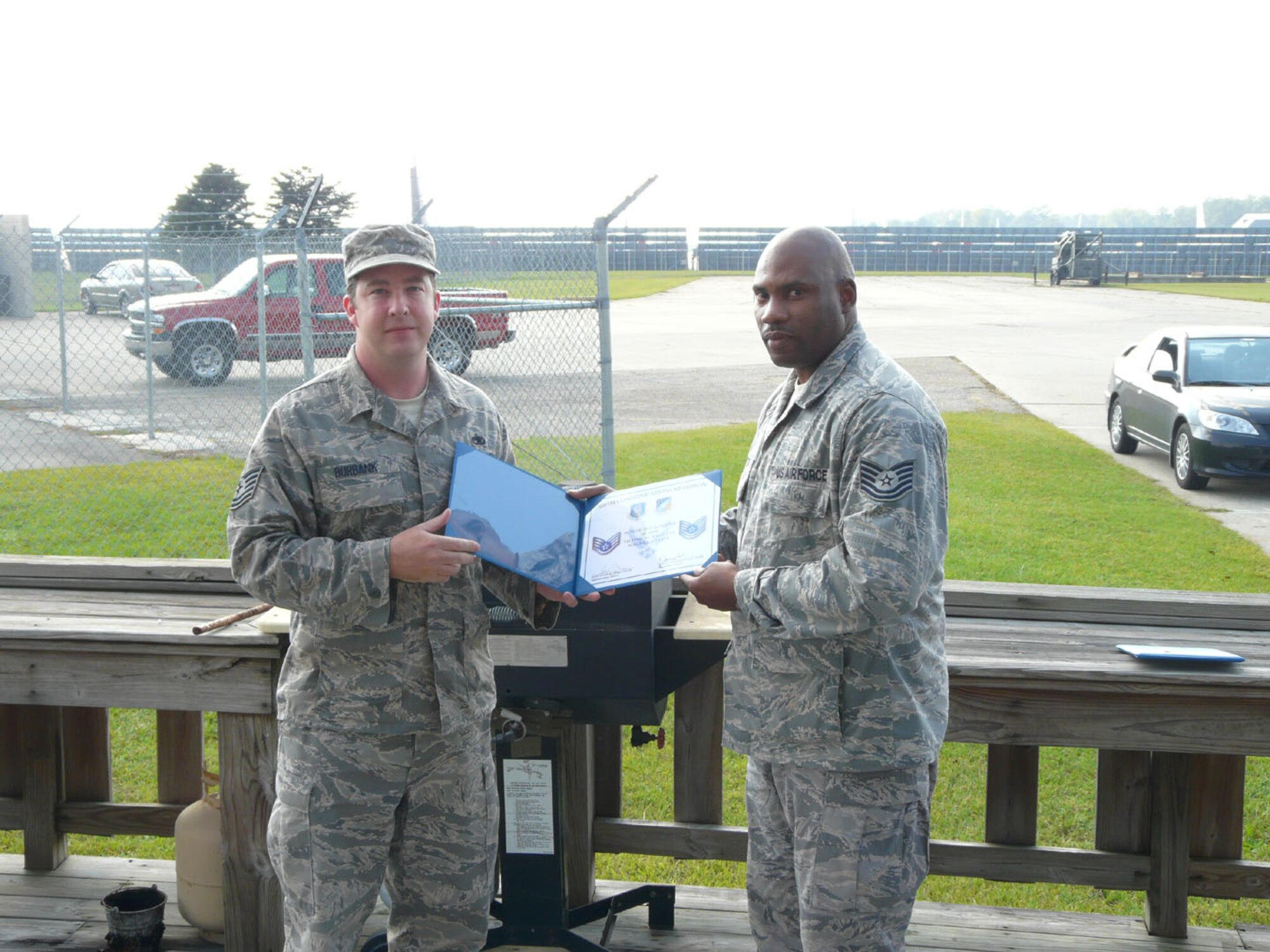 SEYMOUR JOHNSON AIR FORCE BASE, N.C. -- Tech. Sgt. Michael Burbank presents the 916th Communications Squadron NCO of the Quarter award to Tech. Sgt. C. Maurice Carter. Sgt Carter is a voice networking craftsman, but also holds a dual Air Force Specialty Code as a network infrastructure technician. He is a vital member of ?Team Comm? filling the roles of voice networking NCOIC and alternate career assistance advisor.