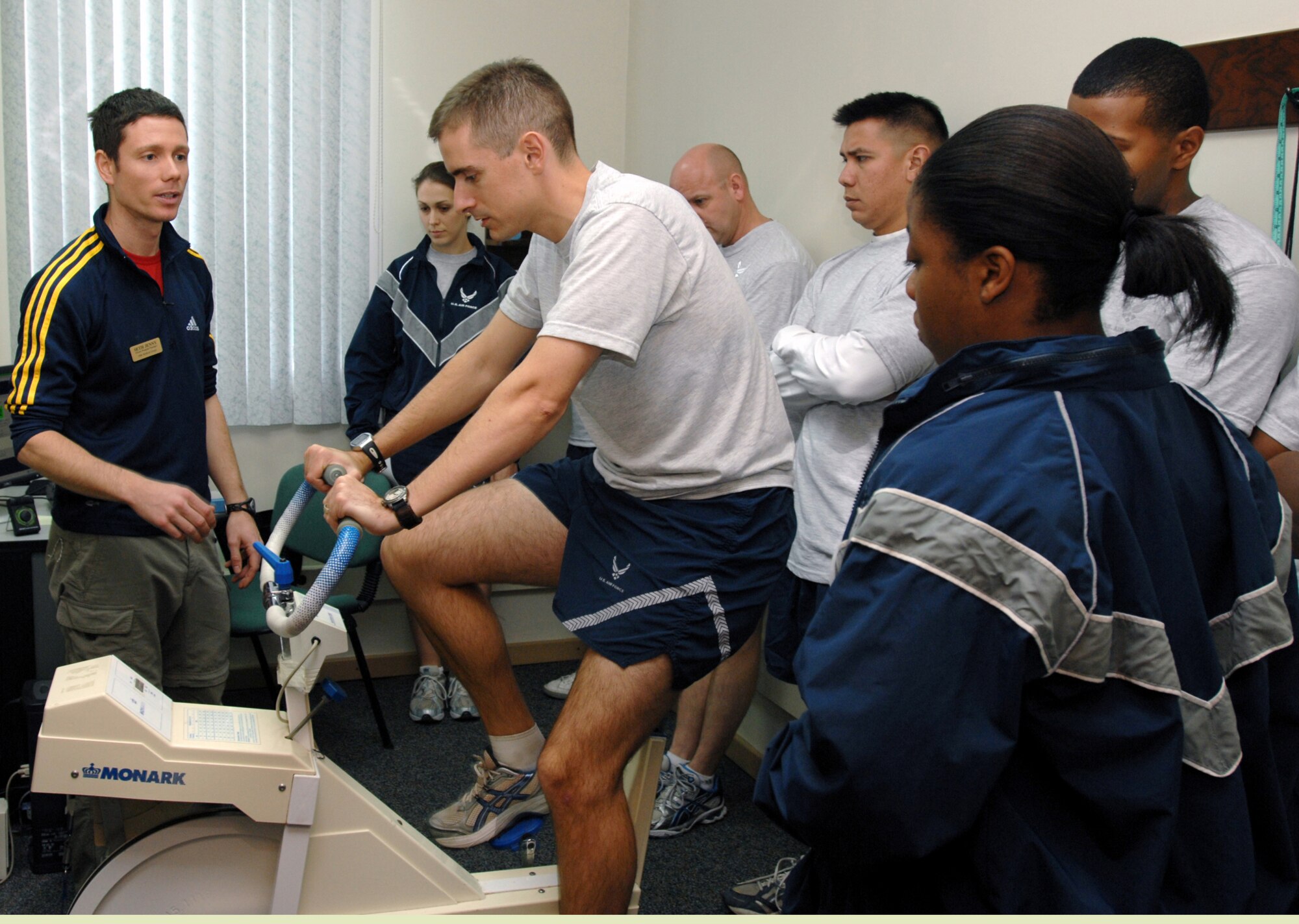 Seth Jenny, 39th Medical Operations Squadron Health and Wellness Center fitness program manager, demonstrates the proper techniques for ergometry testing with Capt. Ian Gregory, 39 MDOS, during a physical training leader training class at the HAWC. (U.S. Air Force photo by Staff Sgt. Jeff Nevison)