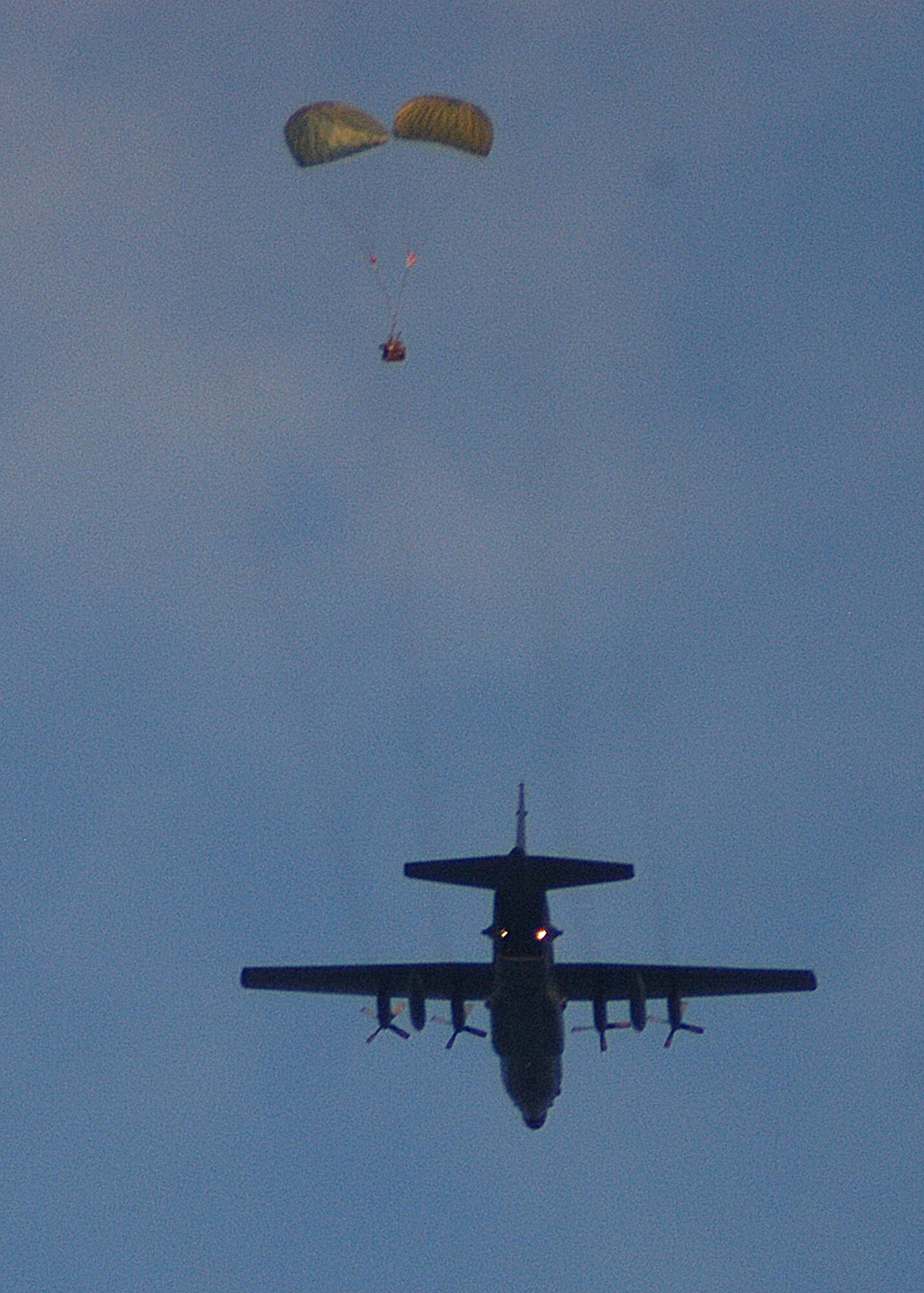 KADENA AIR BASE, Japan -- An aircrew from the 1st Special Operations Squadron airdrops a Riggable Alternate Method Zodiac, or RAMZ, package consisting of an inflatable zodiac boat and engine, from a MC-130H Combat Talon II here Dec. 2. Pararescuemen and combat controllers from the 320th Special Tactics Squadron, who also jumped from the aircraft, used the RAMZ to search for survivors of a simulated aircraft accident. The event was part of a 353rd Special Operations Group training exercise testing the group?s ability to conduct search and rescue operations from start to finish. (U.S. Air Force photo by Tech. Sgt. Aaron Cram)                                  