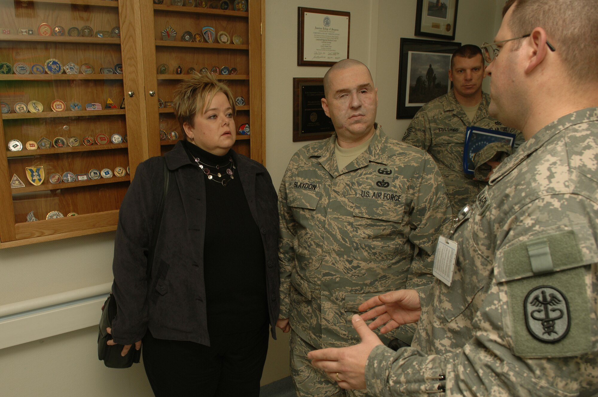 Army Staff Sgt. Daniel Bergles, Intensive Care Unit  noncommissioned officer in charge, explains their daily operations to Staff Sgt. Matthew Slaydon and his wife, Annette, Landstuhl Regional Medical Center, Germany, Nov. 21, 2008. Sgt. Slaydon was severely injured in Iraq 13 months ago during a deployment there as an explosive ordinance disposal technician and is visiting LRMC as part of a morale tour, following his recovery. (U.S. Air Force photo by Airman 1st Class Tony R. Ritter)