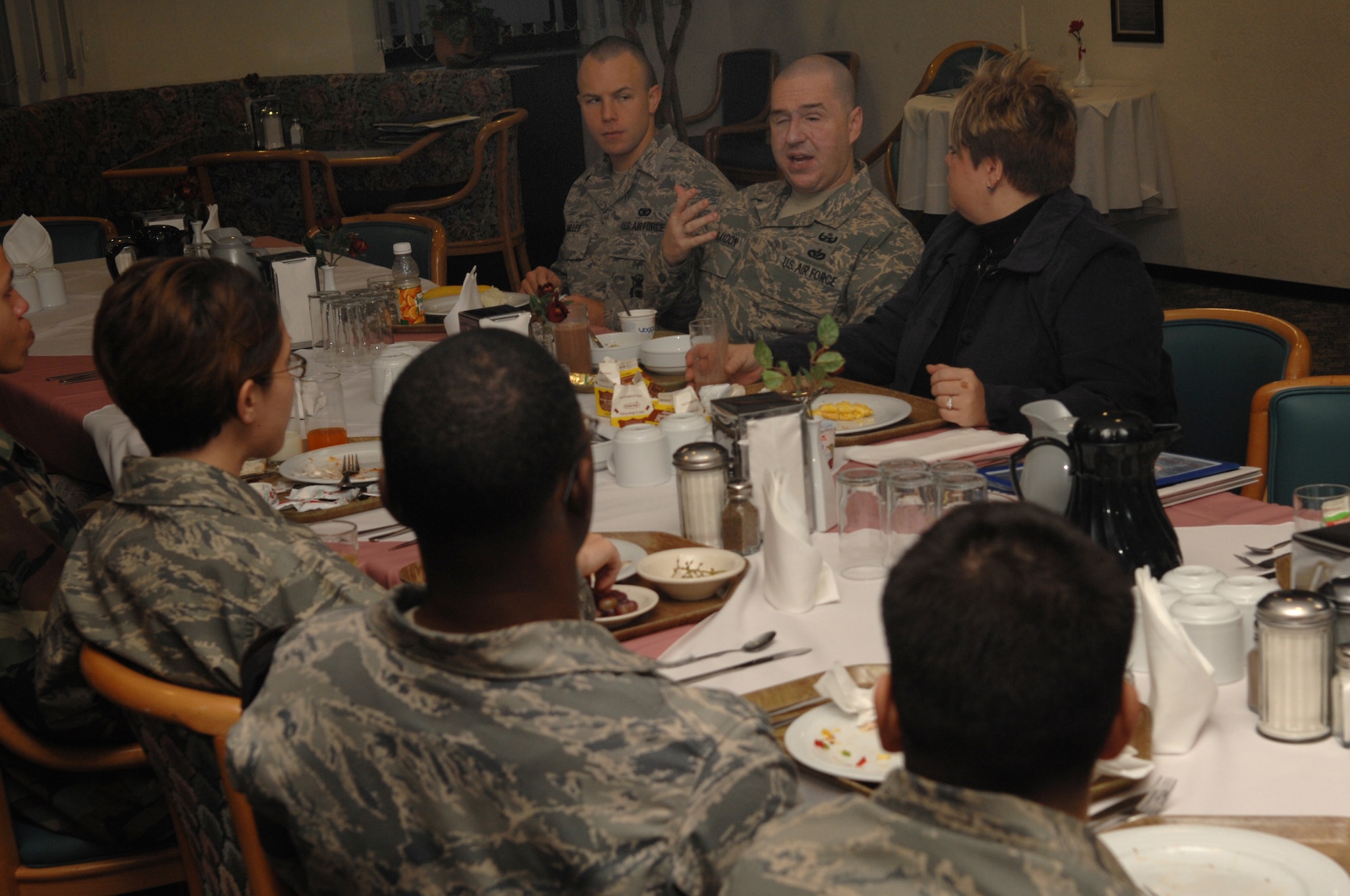 Staff Sgt. Matthew Slaydon and his wife, Annette, speak with airmen over breakfast at the Rheinland Inn Dining Facility, Ramstein Air Base, Germany, Nov. 21, 2008. Sgt. Slaydon was severely injured in Iraq 13 months ago during a deployment there as an explosive ordinance disposal technician and is visiting Ramstein as part of a morale tour, following his recovery. (U.S. Air Force photo by Airman 1st Class Tony R. Ritter)