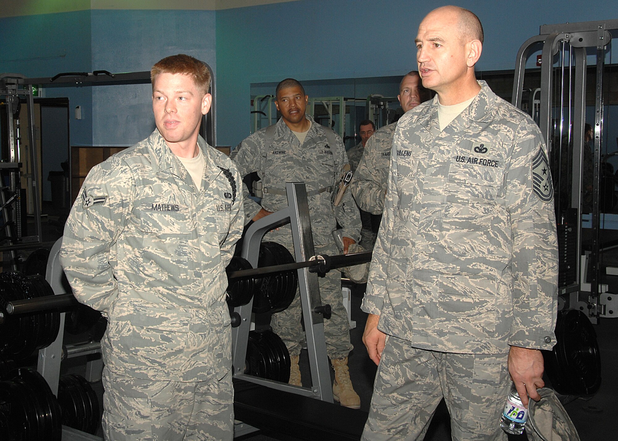 A 386th Expeditionary Wing Airman briefs Chief Master Sgt. Stephen Sullens, Air Combat Command command chief, on the base's fitness programs during the command chief's visit on Nov. 19. Chief Sullens visited with Airmen throughout the U.S. Central Command area of responsibility to see how the mission is progressing, addressing their concerns and thanking them for their service. 