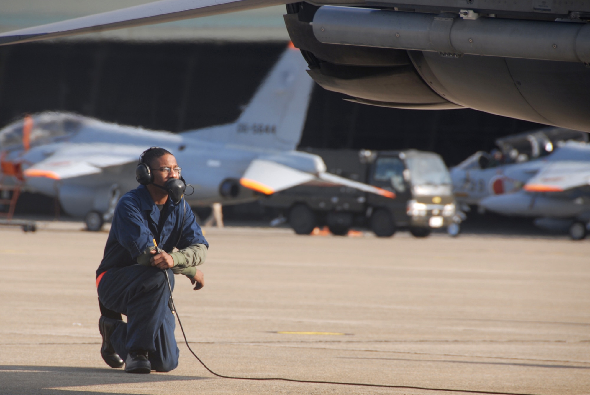 Komatsu Air Base, Japan -- Airman 1st Class Alvin Felder, 35th Aircraft Maintenance Squadron crew chief, launches an F-16 Dec. 2, 2008 after which a 13th Fighter Squadron pilot flew an air-to-air combat sortie with a Japan Air Self-Defense Force 6th Air Wing pilot during an Aircraft Training Relocation event. (U.S. Air Force photo by Staff Sgt. Kelly White) 