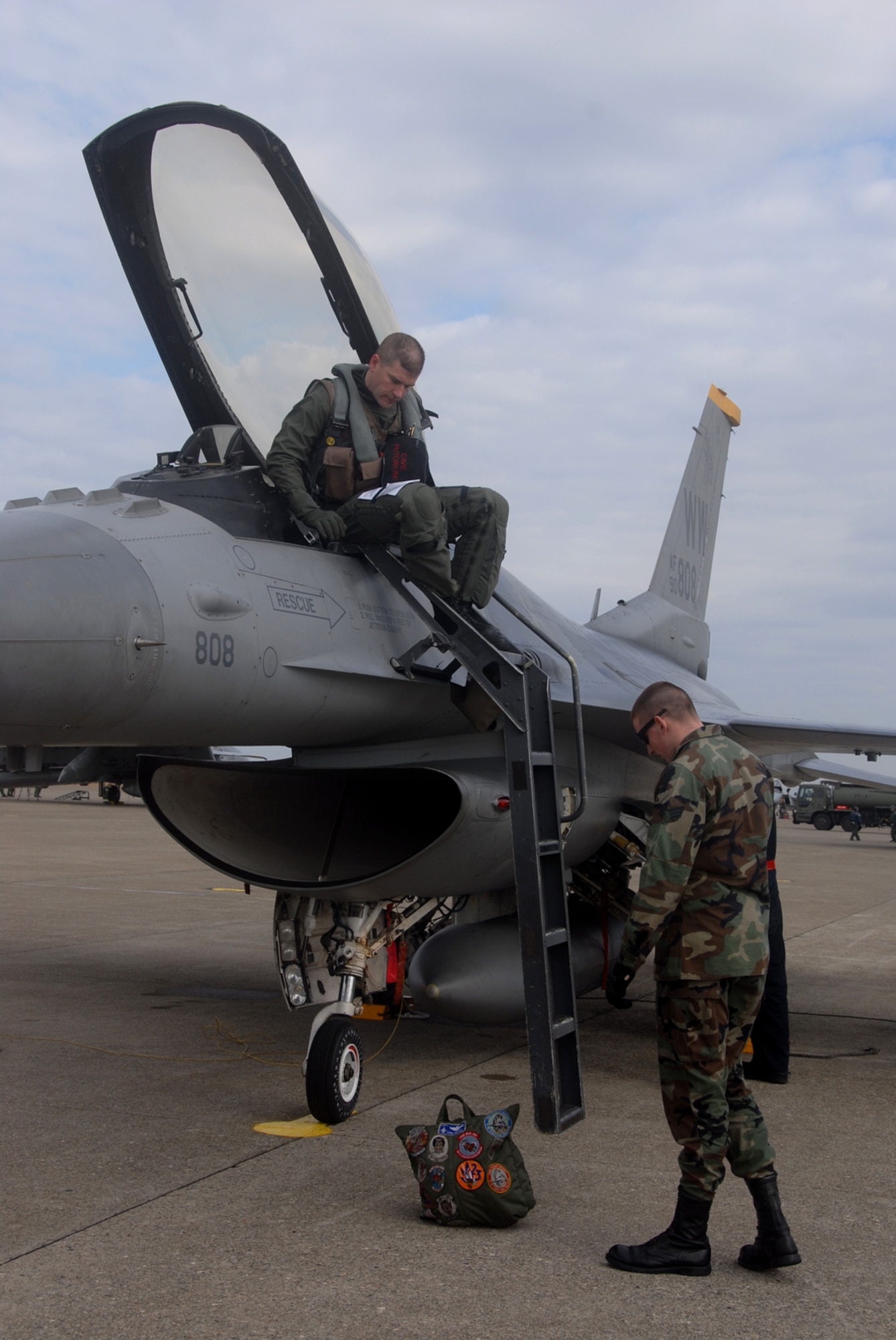 Komatsu Air Base, Japan -- Lt. Col. David Youtsey, 35th Operations Group deputy commander, boards an F-16 on the Japan Air Self-Defense Force 6th Air Wing flightline Dec. 2, 2008.  About 80 Misawa members deployed, including 13th Fighter Squadron pilots, for a week-long Aircraft Training Relocation event. Throughout the week, 13th FS and 6th AW pilots will fly air-to-air combat sorties to increase operational readiness and bilateral interoperability for both U.S. and Japanese forces. (U.S. Air Force photo by Staff Sgt. Kelly White)