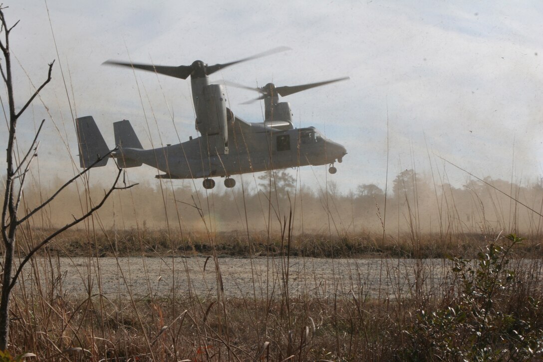 An MV-22B Osprey with Marine Medium Tiltrotor Squadron 263 (Reinforced), the 22nd Marine Expeditionary Unit's Aviation Combat Element, lands to pick up Marines from Weapons Company, Battalion Landing Team, 3rd Battalion, 2nd Marine Regiment, 22nd Marine Expeditionary Unit, after they successfully recovered a Marine role-playing an injured pilot Dec. 4, 2008, during the Tactical Recovery of Aircraft and Personnel course aboard Camp Lejeune, N.C. The purpose of the TRAP course is to ensure Marines with the 22nd MEU are prepared to recover aircraft and personnel should it become necessary. (Official Marine Corps photo by Lance Cpl. Alicia R. Giron)