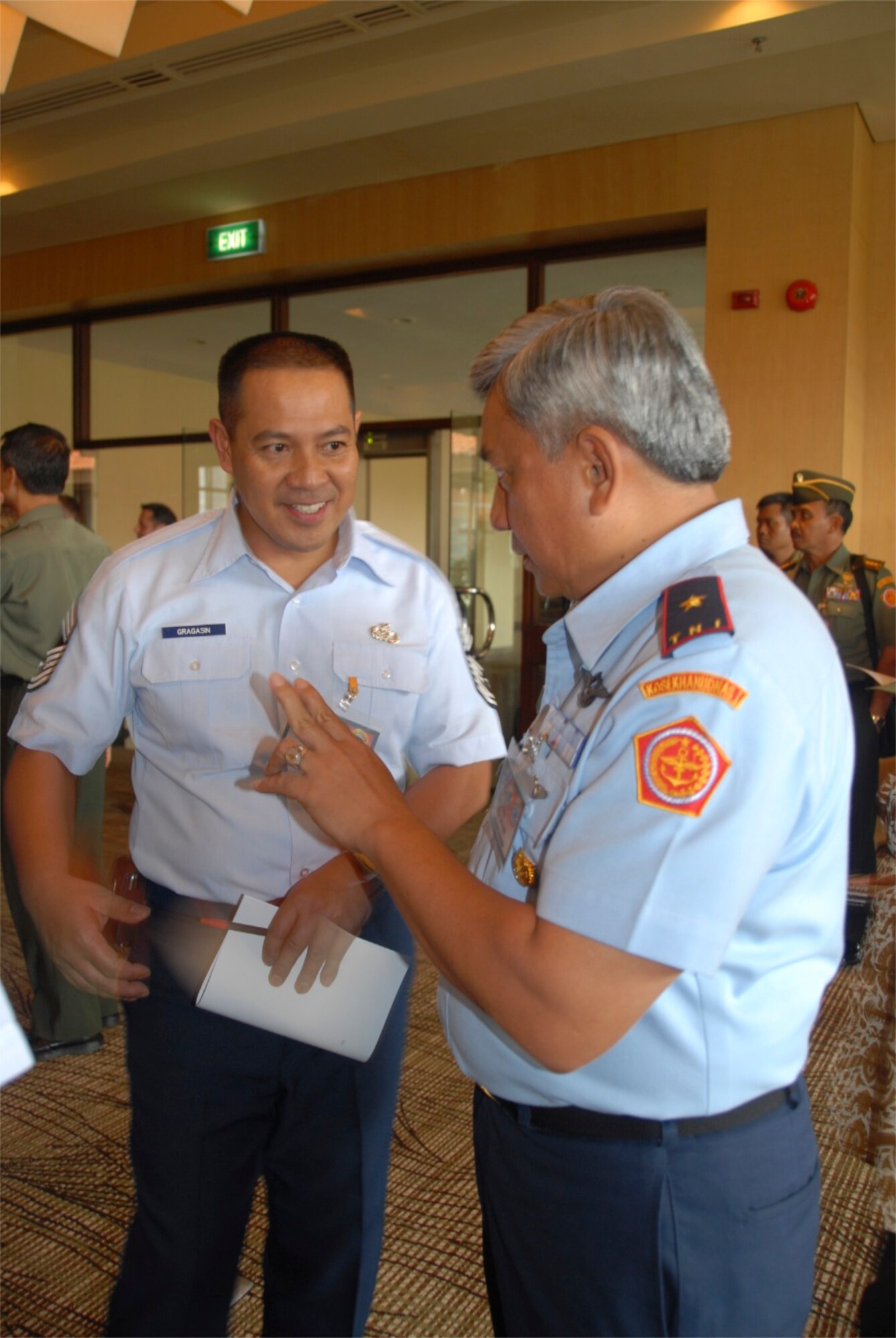 Chief Master Sgt. Art Gragasin, an Individual Mobilization Augmentee with Pacific Air Forces, discusses details of the 2008 Chiefs of Defence Conference with Air Marshal Johnny F.P. Sitompul of the Tentara Nasional Indonesia, or Indonesian Defense Forces in Bali, Indonesia, Thursday, November 13.  Indonesia co-hosted this year's CHOD conference, which is an annual gathering of the Joint Chiefs of Staff equivalents from Asia Pacific nations.  