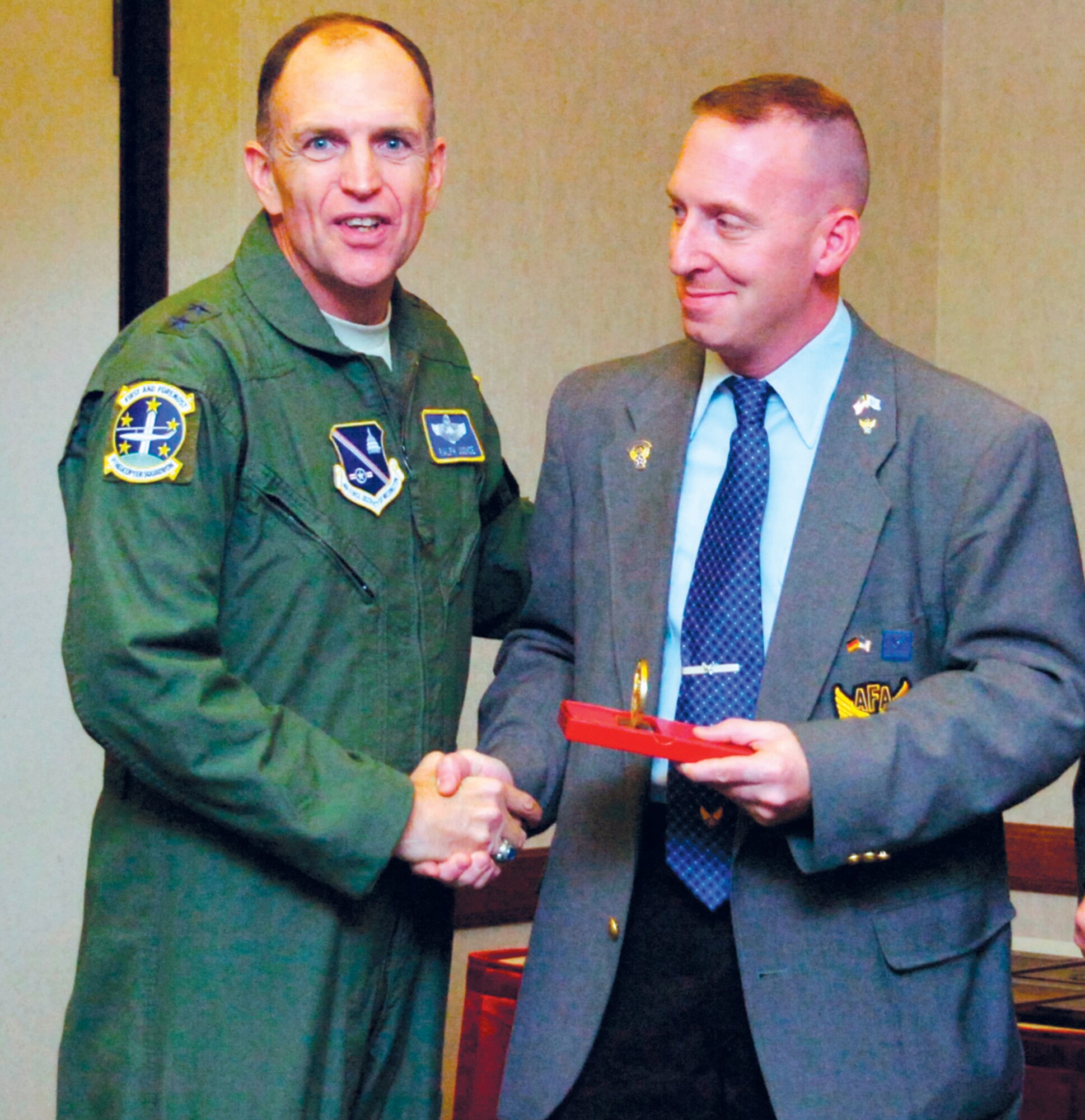 Major Gen. Ralph Jodice, Air Force District of Washington commander, presents Chris Thompson, an Air Force Association member, with a Medal of Merit for his outstanding support of the AFA Thomas W. Anthony Chapter during an AFA awards ceremony Dec. 3. (U.S. Air Force photo by Bobby Jones)