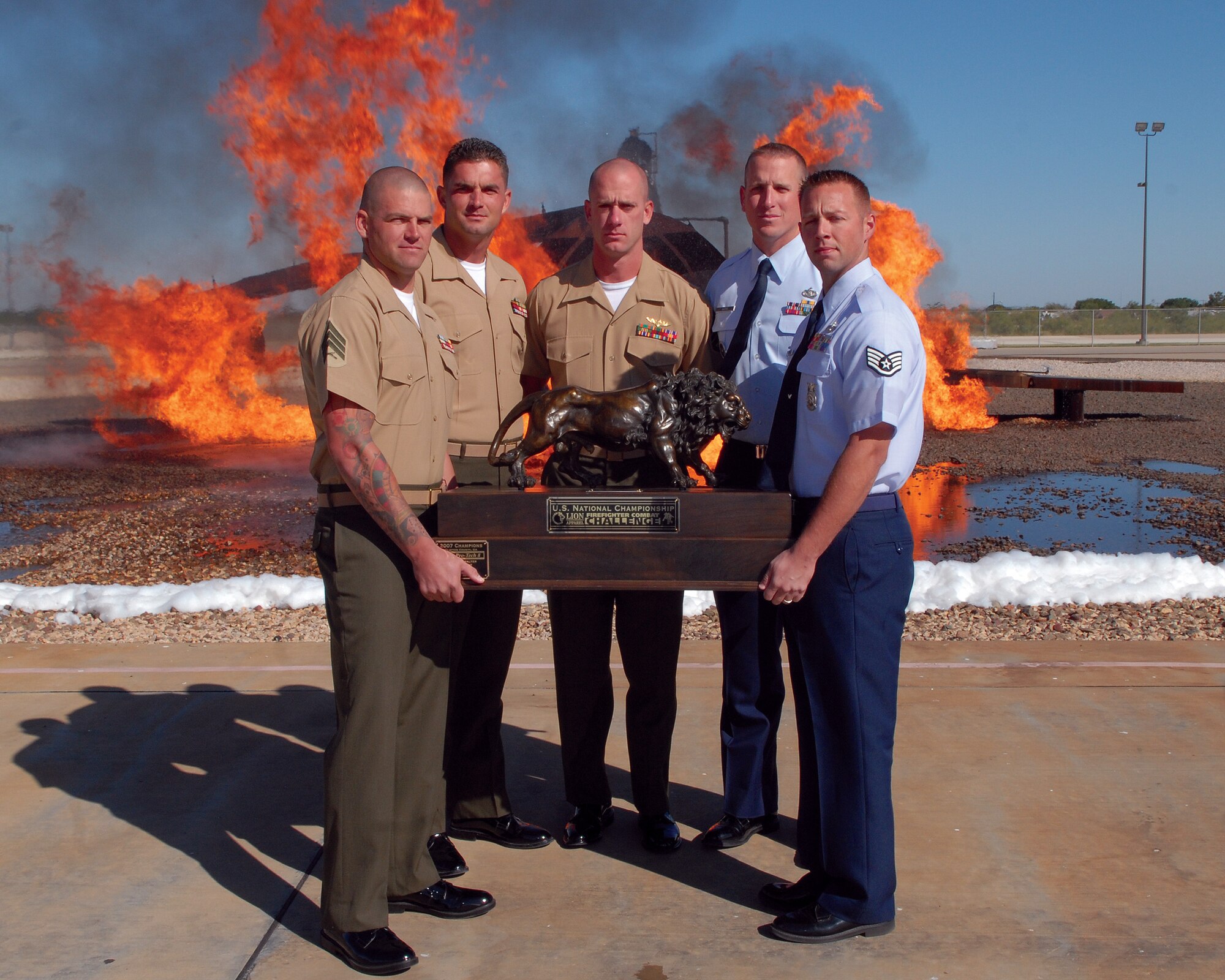 Posing with their trophy from the National Championships are the members of the SAM Squad. From left to right: Marine Corps Sgt. William Alexander, Marine Corps Staff Sgts. Nicholas Cook and Charles Ammon, and Staff Sgts. William Gates and Kevin Wasiewski. The SAM Squad won the National Championships with a time of 5 minutes and 10.58 seconds. (U.S. Air Force photo by Senior Airman Kasabyan Musal)