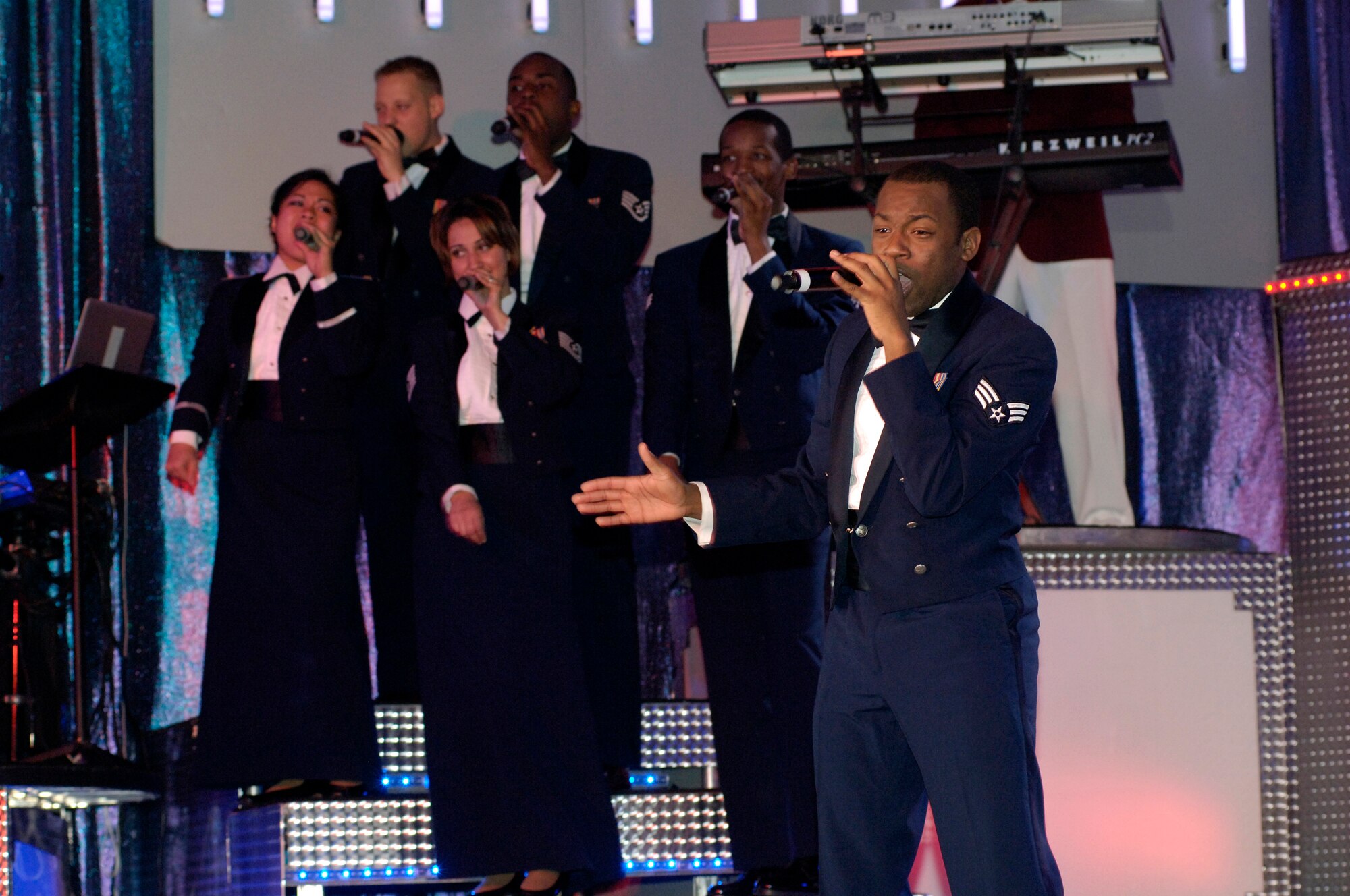 FAIRCHILD AIR FORCE BASE, Wash. – Senior Airman Tommie Crutcher, a member of the Air Force Tops in Blue, performs a solo during their performance at Northern Quest Casino Dec 1. Tops in Blue celebrates 55 years as the Air Force's "Expeditionary Entertainers" by presenting a fun-filled, action-packed performance showcasing musical hits with their own special spin. (U.S. Air Force photo / Senior Airman Eunique Stevens)