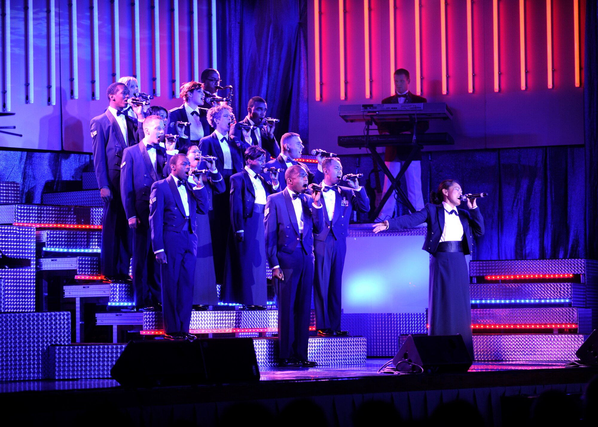 FAIRCHILD AIR FORCE BASE, Wash. – Senior Airman Cristy Lagazo, 92nd Aeromedical Dental Squadron public health journeyman, sings the final note of the Tops in Blue show Deja Blue during a performance at Northern Quest Casino in Airway Heights, Wash., Dec. 1. Performers travel to Air Force bases around the globe to entertain and aid in recruiting efforts. (U.S. Air Force photo / Senior Airman Joshua K. Chapman)