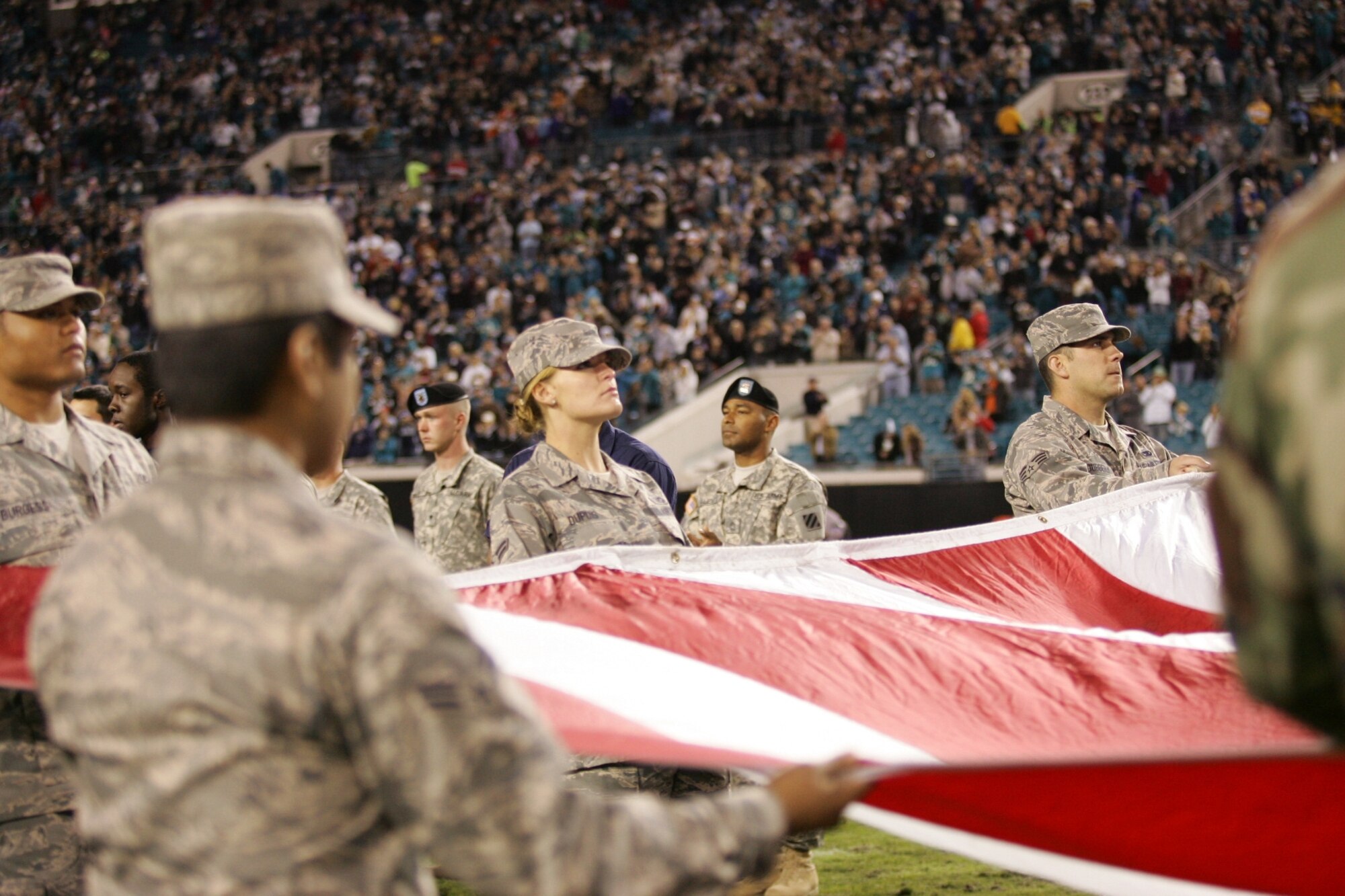 More than 65 Tyndall Airmen participated in Military Appreciation Day hosted by the Jacksonville Jaguars Nov. 16. Local Airmen we joined by sailors, soldiers and marines from the North Florida area during the game's opening ceremonies and singing of the National Anthem. (Photo by Paul Figura) 