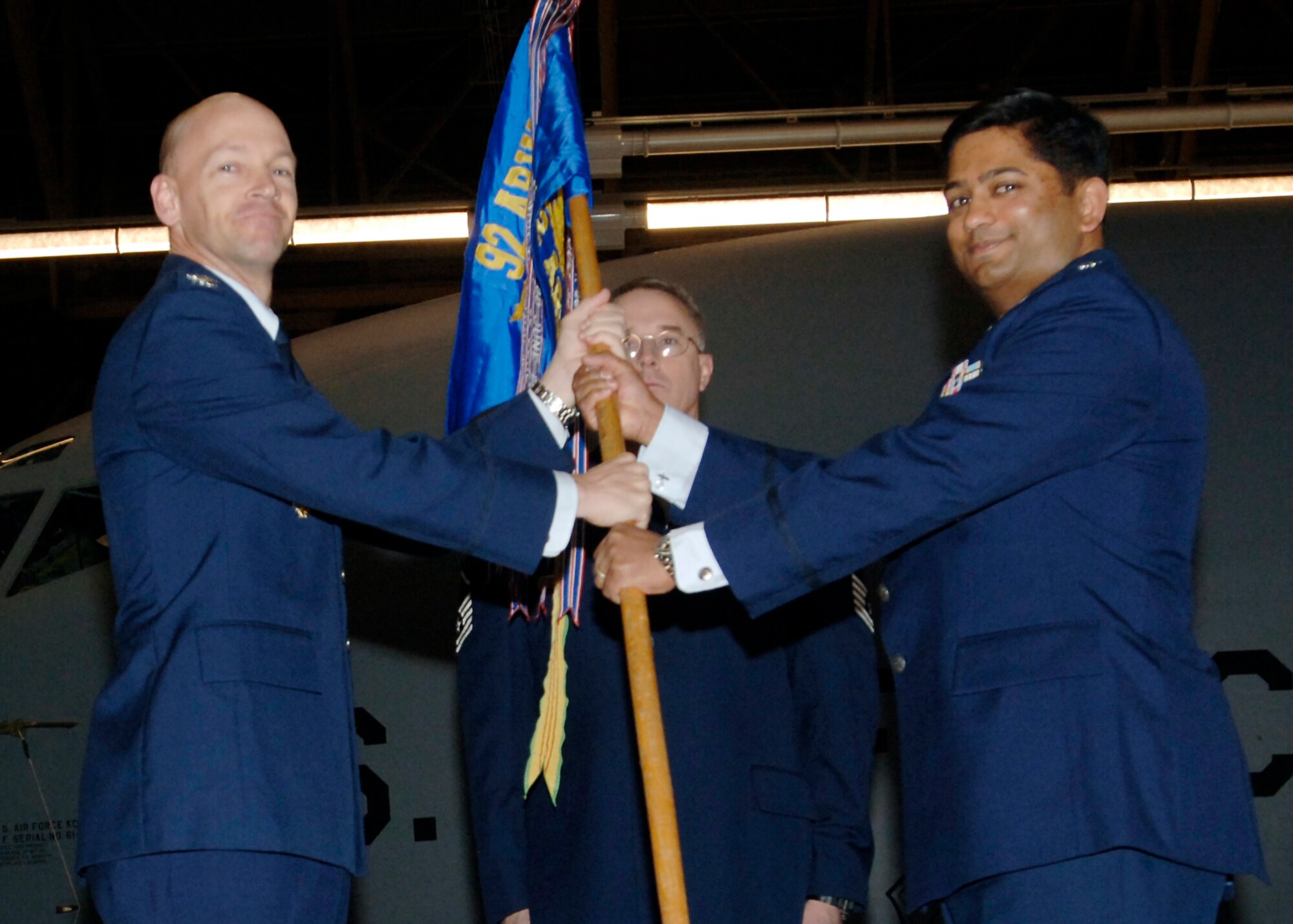 FAIRCHILD AIR FORCE BASE, Wash. – Col. Marshall Morrison, 92nd Operations Group commander, presents Lt. Col. Sushil Ramrakha, 92nd Air Refueling Squadron commander, with the squadron guideon during the 92nd ARS change-of-command ceremony here Nov. 26. Colonel Ramrakha was formerly the 93rd ARS director of operations. (U.S. Air Force photo / Airman 1st Class Melissa L. Barnett)

