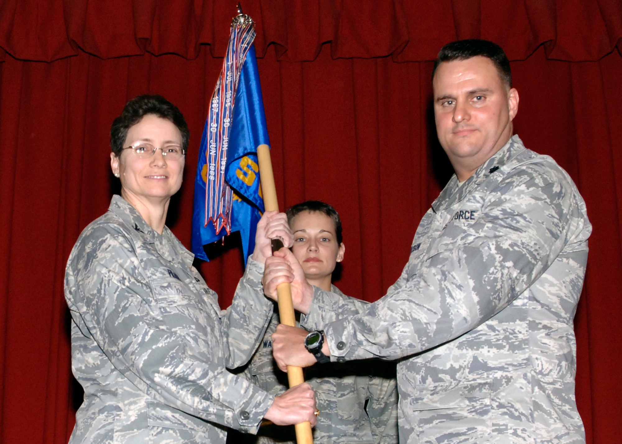 FAIRCHILD AIR FORCE BASE, Wash. – Col. Suzzane Filion, 92nd Mission Support Group commander, relinquishes command from Lt. Col. David Ellison, former 92nd Services Squadron commander, during the 92nd Mission Support Squadron and 92nd SVS Merging Ceremony Dec. 2. In 2006 the Air Force began the merge between the MSS and SVS to provide total support to the entire wing under one commander.  Merging both missions will strengthen the synergy and unity of the command. (U.S. Air Force photo / Airman 1st Class Melissa L. Barnett)
