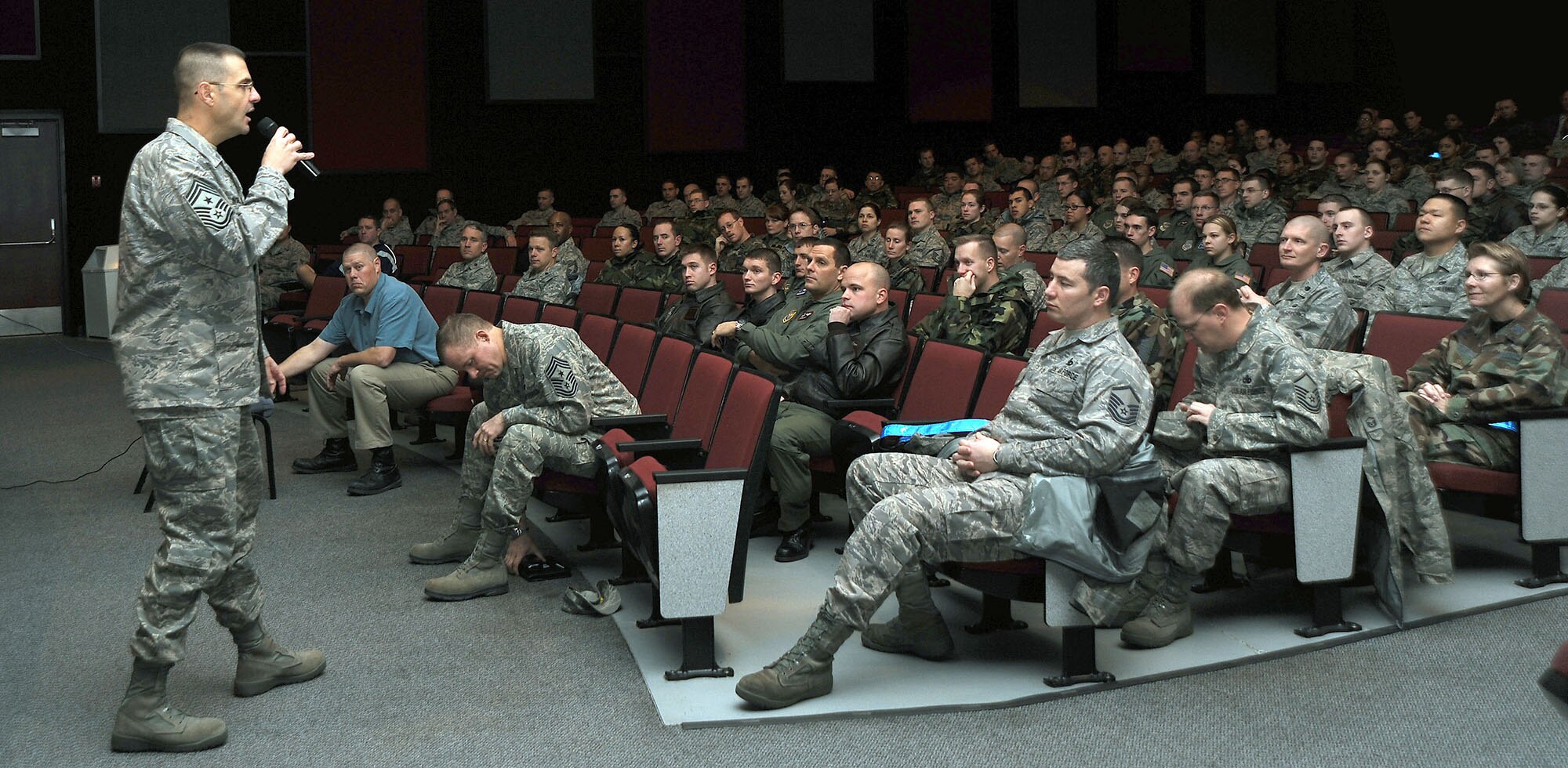 FAIRCHILD AIR FORCE BASE, Wash. – Chief Master Sgt. David Nordel, 92nd Air Refueling Wing command chief, explains the importance of safety to a crowded audience at the base theater Dec. 4. Through an imaginative exercise, the chief highlighted the incidences of everyday safety mishaps by showing that every almost every Fairchild Airman has been affected by accident, death or suicide. (U.S. Air Force photo / Staff Sgt. JT May III)