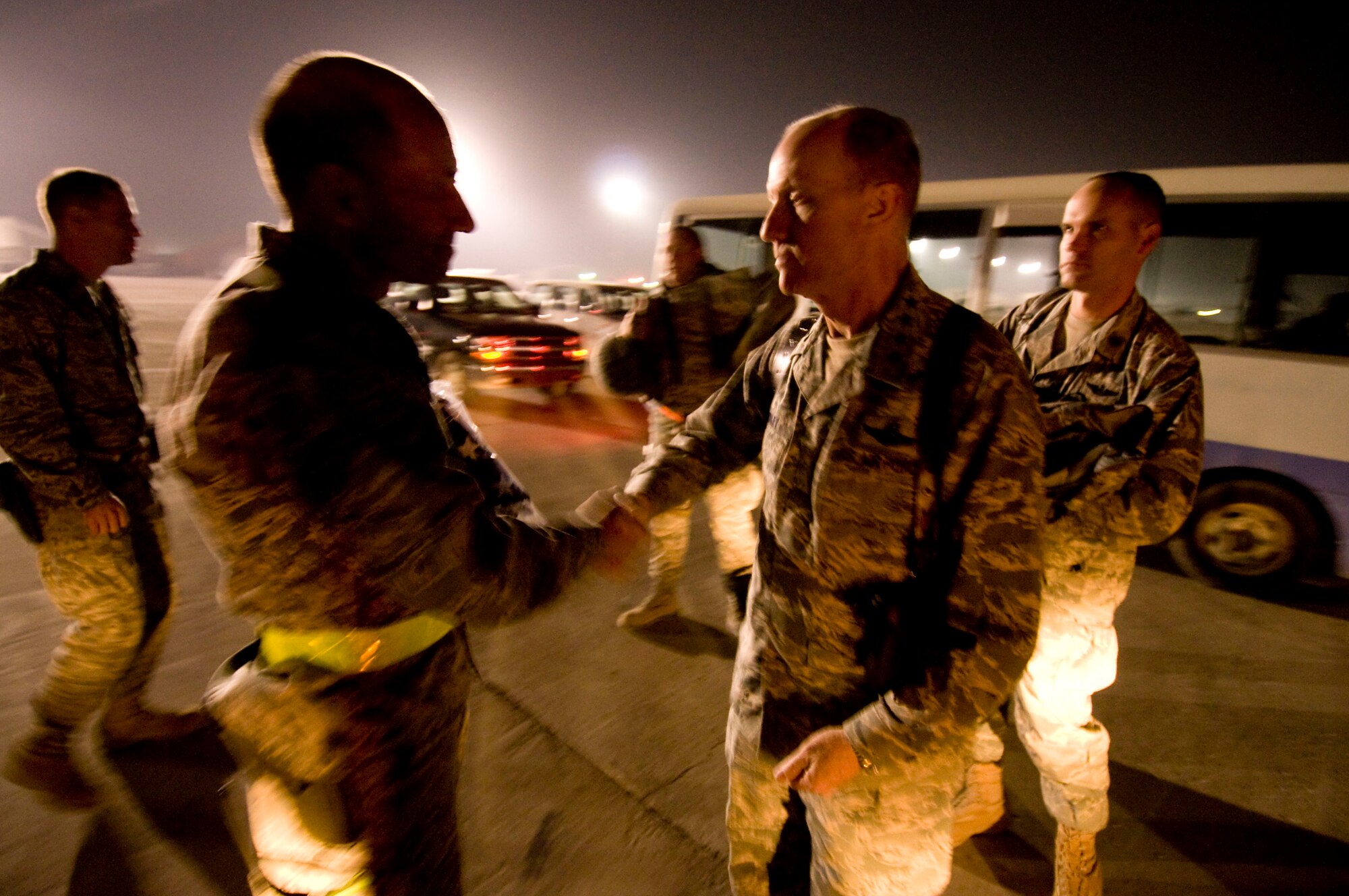Gen. John Corley, Air Combat Command commander, gives a final handshake to Brig. Gen. Mike Holmes, 455th Air Expeditionary Wing commander, at Bagram Air Field, Afghanistan, Dec. 4. General Corely expressed his gratitude for the hard work the Airmen of the 455th AEW do every day. (U.S. Air Force photo by Staff Sgt. Samuel Morse)(Released)