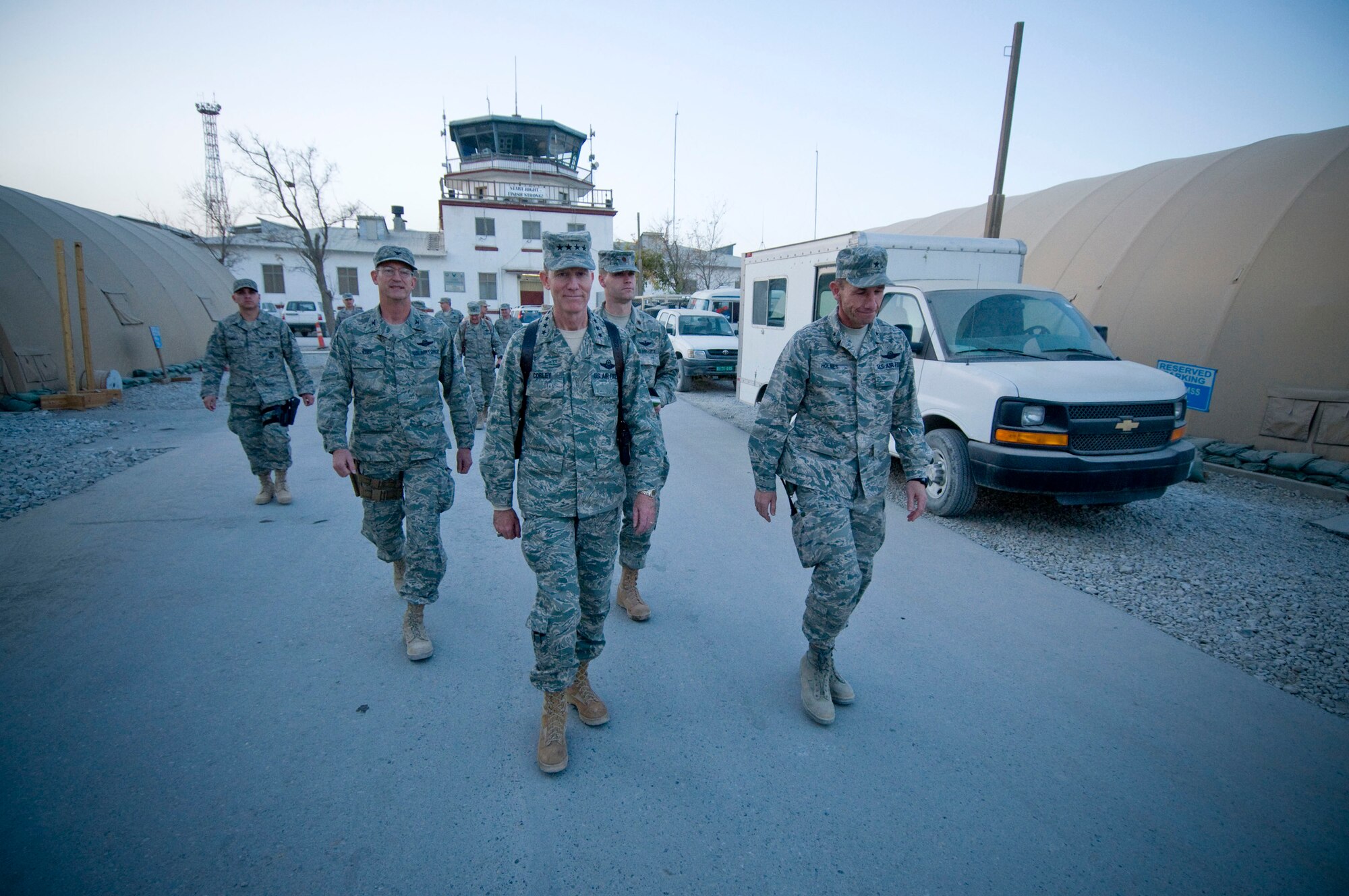 Gen. John Corley, Air Combat Command commander, walks through Camp Cunningham at Bagram Air Field, Afghanistan, Dec. 4. The historic tower in the background was the original tower built by the former Soviet Union. (U.S. Air Force photo by Staff Sgt. Samuel Morse)(Released)