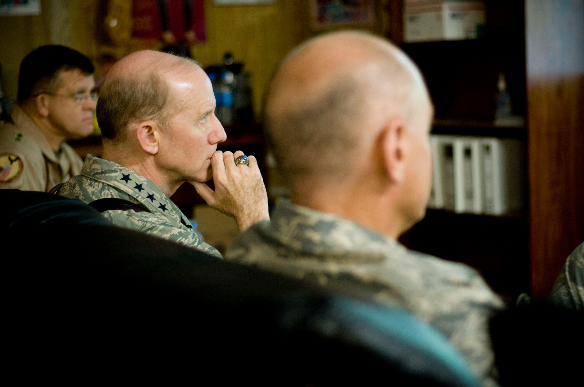 Gen. John Corley, Air Combat Command commander, listens to a mission brief from the fighter squadrons at Bagram Air Field, Afghanistan, Dec. 4. General Corley asked about pre-deployment training, trying to streamline the process so pilot deploying to Afghanistan are prepared for the challenges faced during the close-air support mission. (U.S. Air Force photo by Staff Sgt. Samuel Morse)(Released)