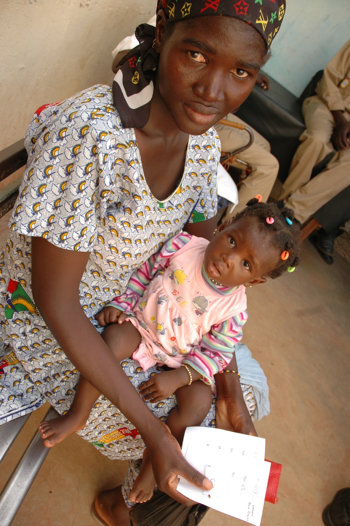 A Malian woman and her daughter wait to collect their prescriptions at a medical civil action program (MEDCAP) in Bamako, Mali recently. U.S. Air Force and Army medics and volunteers from the 1st Special Operations Wing and 352nd SOG treated nearly 400 Malian men, women and children in just eight hours. The Airmen were in Africa supporting FLINTLOCK, a joint/combined training exercise conducted regularly in the Trans-Saharan region designed to build capacity and foster interoperability among African nations, and conducted the MEDCAP as part of a local humanitarian mission. (U.S. Air Force photo/1st Lt. Jon Saas)