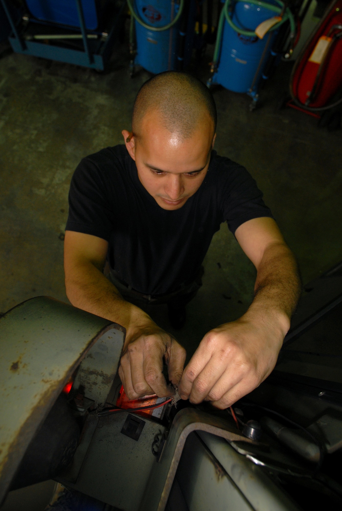 KUNSAN AIR BASE, Republic of Korea -- Staff Sgt. Jason Peters, 8th Logistic Readiness Squadron, vehicle maintenance craftsman, diagnoses an electrical problem of the spot light of a 6K Hysler fork lift here Dec. 4.The Wolf Pack’s vehicle maintenance Airmen are responsible for keeping more than 600 general and special purpose vehicles operational for the Airmen, Soldiers and civilians assigned to the base. (U.S. Air Force photo by: Senior Airman Angela Ruiz)