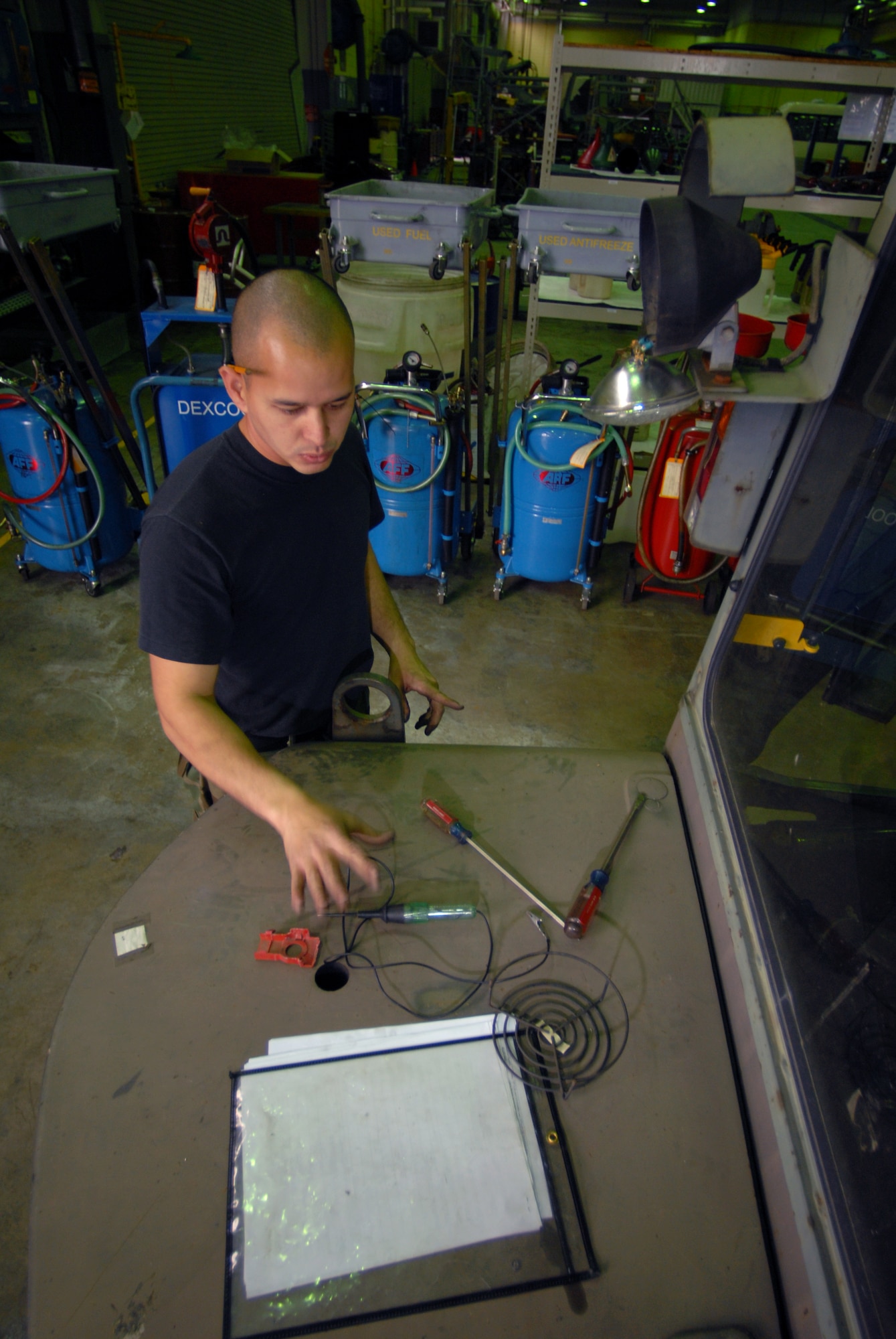 KUNSAN AIR BASE, Republic of Korea -- Staff Sgt. Jason Peters, 8th Logistic Readiness Squadron, vehicle maintenance craftsman, reaches for a tool off of a 6K Hysler fork lift here Dec. 4.The Wolf Pack’s vehicle maintenance Airmen are responsible for keeping more than 600 general and special purpose vehicles operational for the Airmen, Soldiers and civilians assigned to the base. (U.S. Air Force photo by: Senior Airman Angela Ruiz)