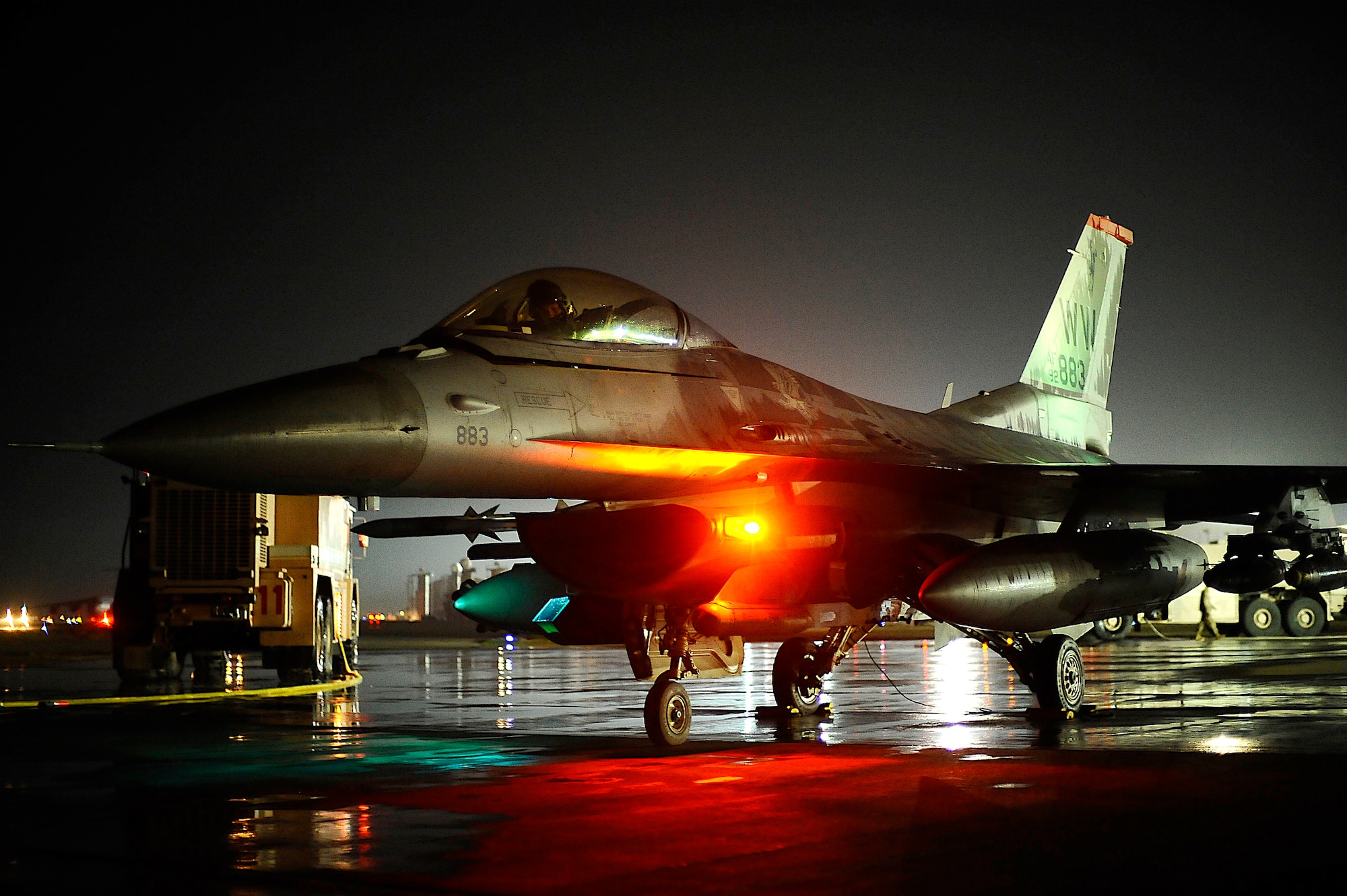 Col. John Dolan, vice commander of the 332nd Air Expeditionary Wing, prepares to egress his aircraft at Joint Base Balad, Iraq, after he completed his 3,000th flying hour in an F-16 Fighting Falcon Dec. 2. Cols. Michael Fantini and David Romuald also completed their 3,000th F-16 flying hour that evening. Approximately 150 F-16 pilots have surpassed this milestone. Fantini is the commander of the 332nd Expeditionary Operations Group and Romauld is the 332nd Expeditionary Operations Group deputy commander. (U.S. Air Force photo/Airman 1st Class Jason Epley)(Released)