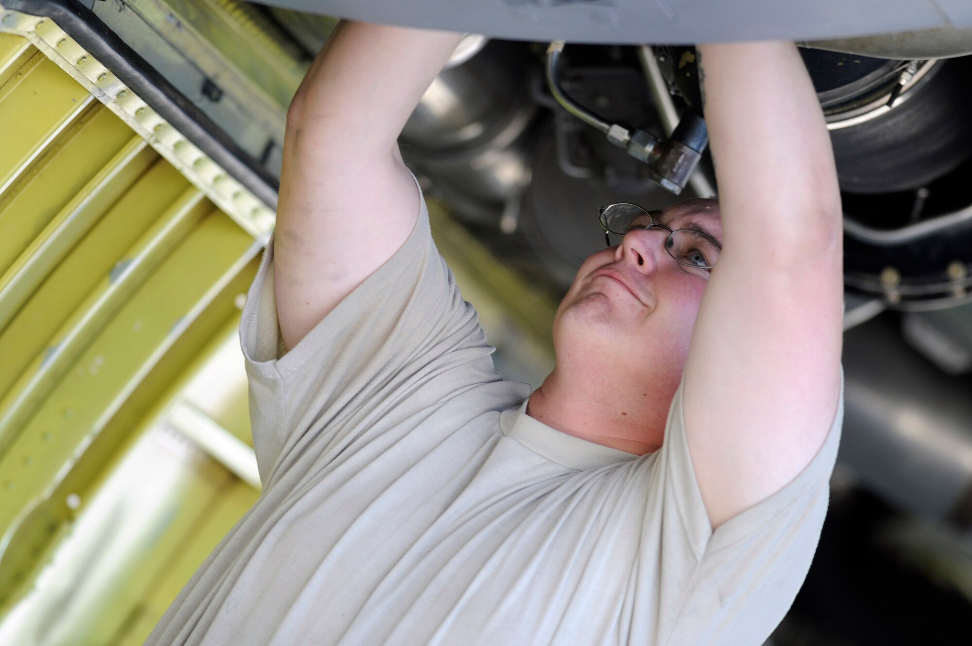 Staff Sgt. Joshua Gill a hydraulic systems craftsman assigned to the 379th Expeditionary Aircraft Maintenance Squadron tightens connections on an air refueling pump control valve on a KC-135 Stratotanker, Dec. 4, at an undisclosed air base in Southwest Asia.  The KC-135 Stratotanker provides the core aerial refueling capability for the United States Air Force; it also provides aerial refueling support to Navy, Marine Corps and allied nation aircraft in the Central Command area of responsibility.  Sergeant Gill is deployed from McConnell Air Force Base, Kan., in support of Operations Iraqi and Enduring Freedom and Joint Task Force-Horn of Africa.  (U.S. Air Force photo by Tech. Sgt. Michael Boquette/Released)