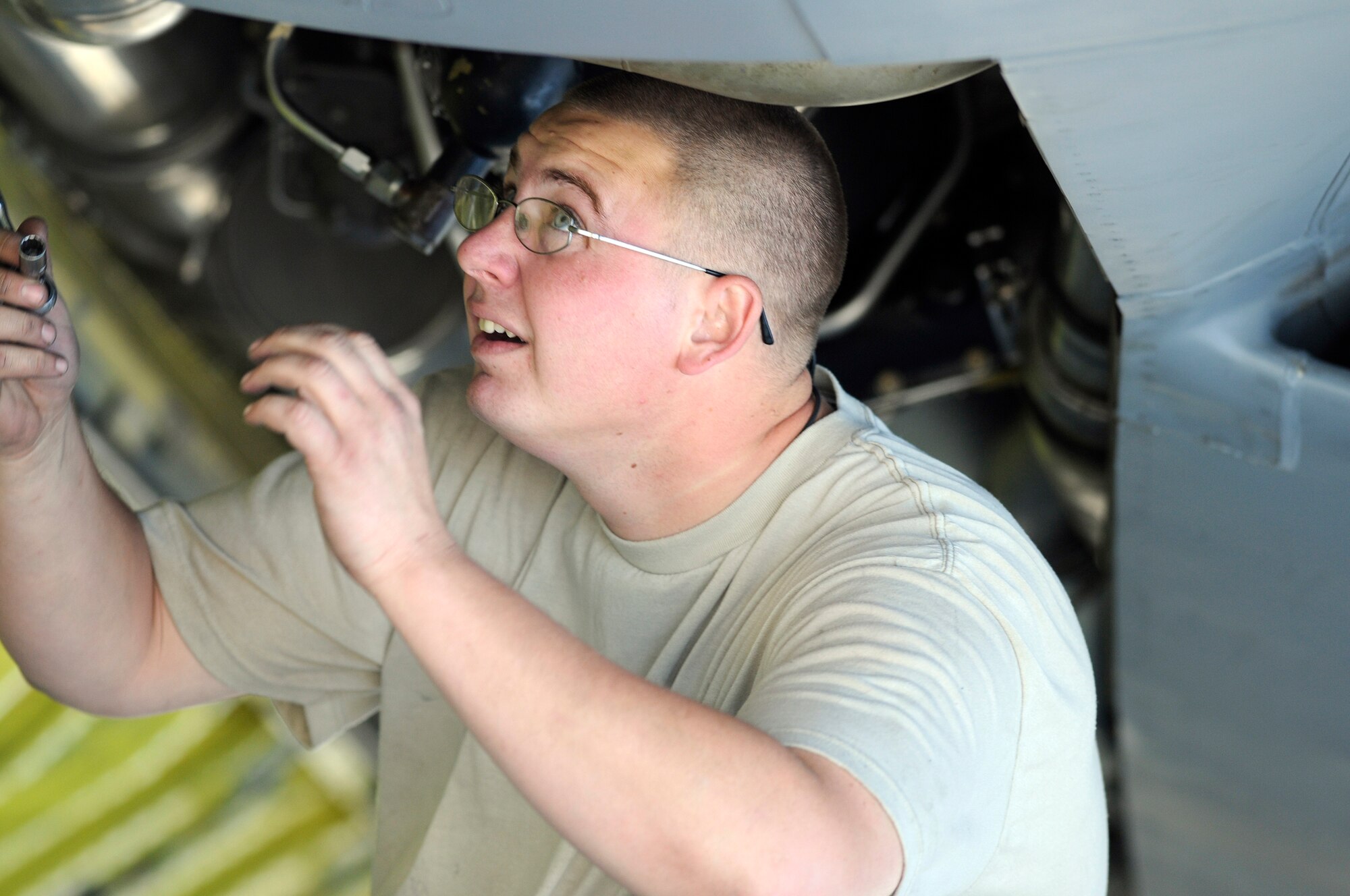 Staff Sgt. Joshua Gill a hydraulic systems craftsman assigned to the 379th Expeditionary Aircraft Maintenance Squadron, uses a ratchet to tighten an air refueling pump control valve on a KC-135 Stratotanker, Dec. 4, at an undisclosed location in Southwest Asia.  The KC-135 Stratotanker provides the core aerial refueling capability for the United States Air Force; it also provides aerial refueling support to Navy, Marine Corps and allied nation aircraft in the Central Command area of responsibility.  Sergeant Gill is deployed from McConnell Air Force Base, Kan., in support of Operations Iraqi and Enduring Freedom and Joint Task Force-Horn of Africa.  (U.S. Air Force photo by Tech. Sgt. Michael Boquette/Released)