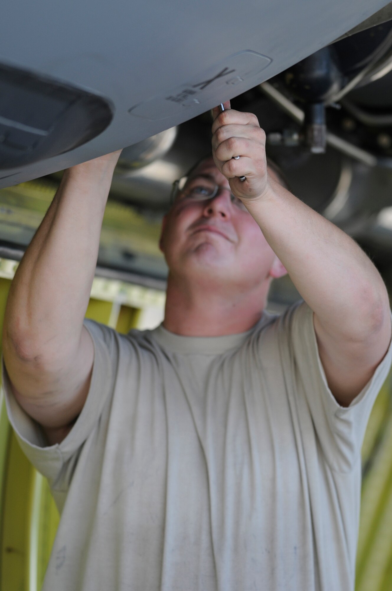 Staff Sgt. Joshua Gill a hydraulic systems craftsman assigned to the 379th Expeditionary Aircraft Maintenance Squadron finishes the replacement of an air refueling pump control valve on a KC-135 Stratotanker, Dec. 4, at an undisclosed air base in Southwest Asia.  The KC-135 Stratotanker provides the core aerial refueling capability for the United States Air Force; it also provides aerial refueling support to Navy, Marine Corps and allied nation aircraft in the Central Command area of responsibility.  Sergeant Gill is deployed from McConnell Air Force Base, Kan., in support of Operations Iraqi and Enduring Freedom and Joint Task Force-Horn of Africa.  (U.S. Air Force photo by Tech. Sgt. Michael Boquette/Released)