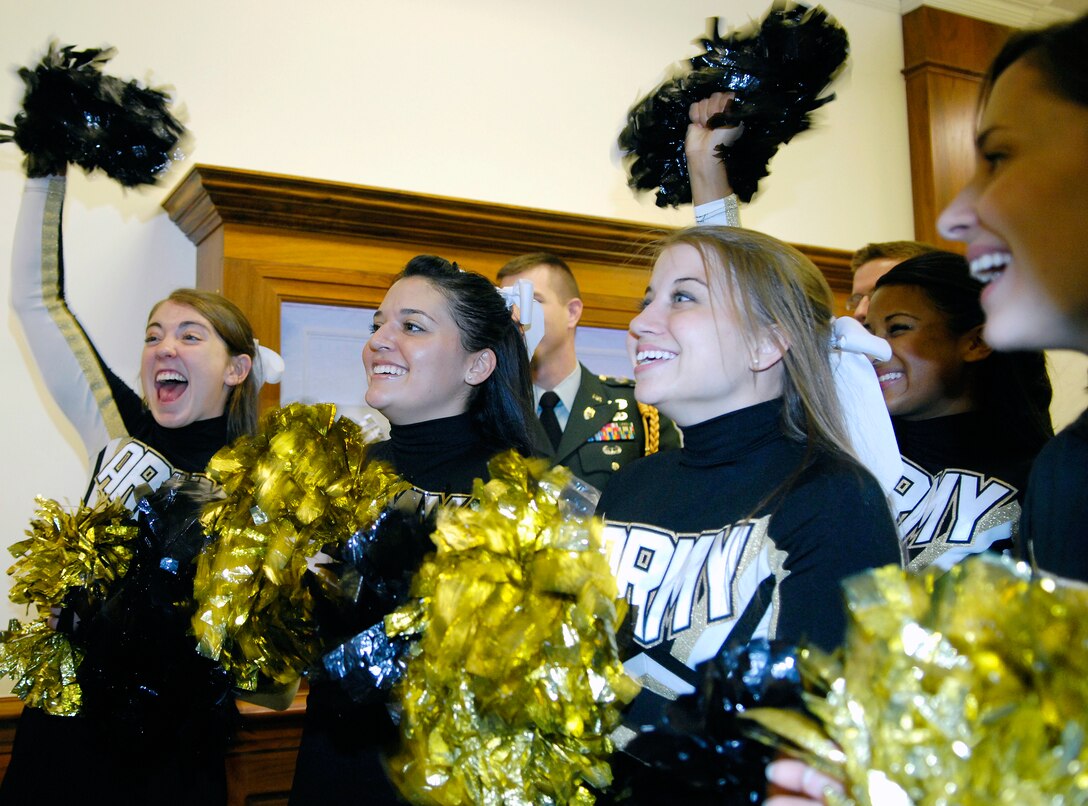 U.S. Army West Point Pep Band cheerleaders shout after a short speech from U.S. Navy Adm. Mike Mullen, chairman of the Joint Chiefs of Staff, during their tour of the Pentagon, Dec. 5, 2008, in anticipation of the Dec. 6 Army-Navy football game in Philadelphia.