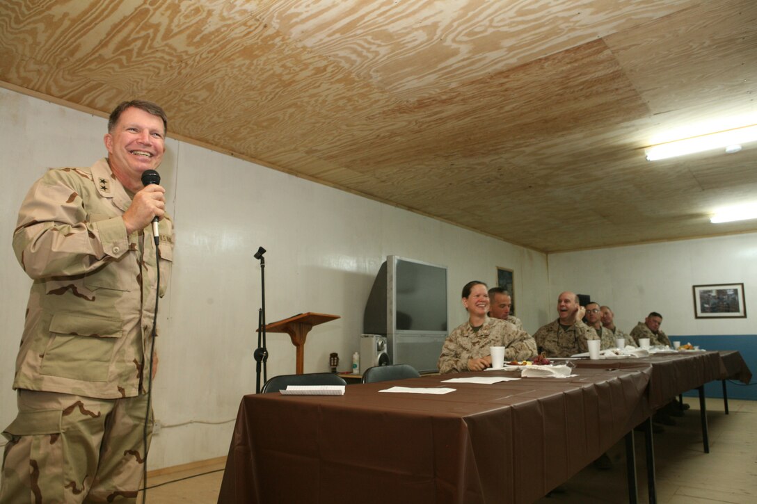 Chief of Navy Chaplains Rear Adm. Robert Burt speaks to service members during a prayer breakfast at Camp Ramadi, Iraq, Dec. 5. Burt spoke about some of the things he has experienced in his 38 years in the military and how thankful he is for the service of all the men and women serving in Iraq.