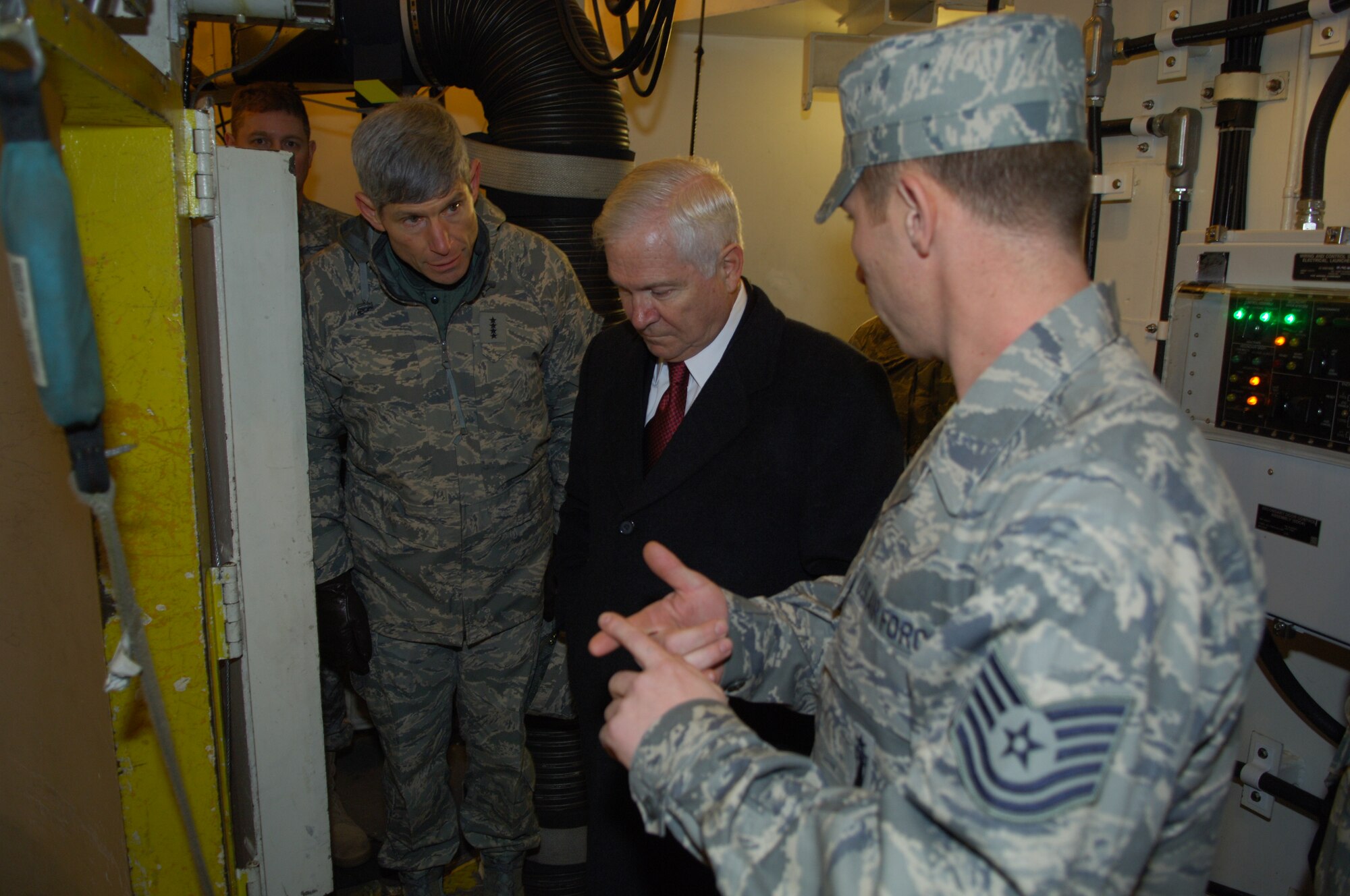Tech. Sgt. Donald Waugh, 91st Missile Operations Squadron at Minot Air Force Base, N.D., briefs Secretary of Defense Robert Gates and Chief of Staff of the Air Force Gen. Norton Schwartz Dec. 1 on the electro mechanical technician's job inside the Uniform 01 launch facility. (U.S. Air Force photo/Senior Airman Cassandra Jones)