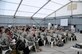 SOUTHWEST ASIA -- Senior Airman Stephanie Robinson from the 380th Expeditionary Force Support Squadron briefs personnel at their initial in-processing briefing here Nov. 21. PERSCO manages the transition every time with an initial briefing to ensure all paperwork is current and available, followed by a Warrior Brief with specific about the 380th. Airman Robinson is deployed from the 341st FSS, Malmstrom Air Force Base, Mont., her hometown is Eatonville, Wash. (U.S. Air Force photo/Tech. Sgt. Christopher A. Campbell)(released)