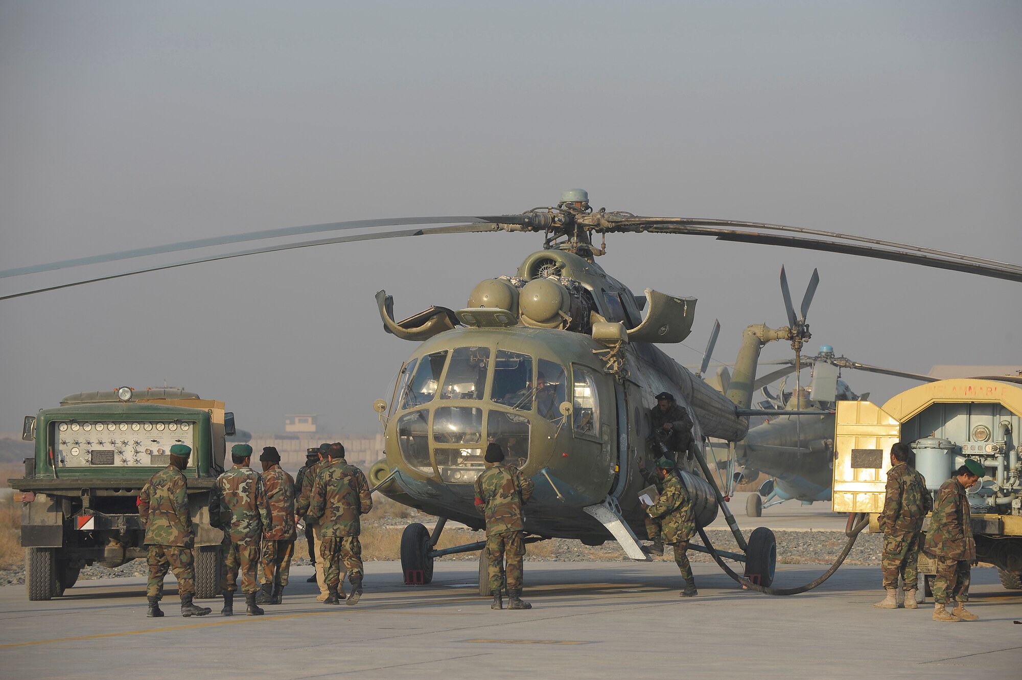 KABUL, Afghanistan -- Afghan National Army Air Corps Mi-17 maintenance crews prepare the helicopter for a mission supporting the Afghan National Army here. The ANAAC is being mentored by the 438th Air Expeditionary Wing and has made great advances in its ability to support the Afghan National Army.
(U.S. Air Force photo/Master Sgt. Keith Brown)