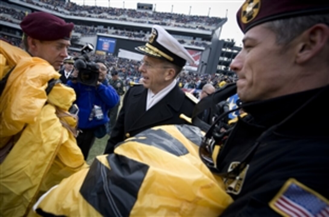 Navy Adm. Mike Mullen, chairman of the Joint Chiefs of Staff, greets the Army’s Golden Knights parachute team prior to kickoff at the 109th playing of the Army-Navy football game at Lincoln Financial Field in Philadelphia, Dec. 6, 2008. The U.S. Naval Academy Midshipmen extended their winning streak over Army to seven with a 34-0 win over the U.S. Military Academy Black Knights.