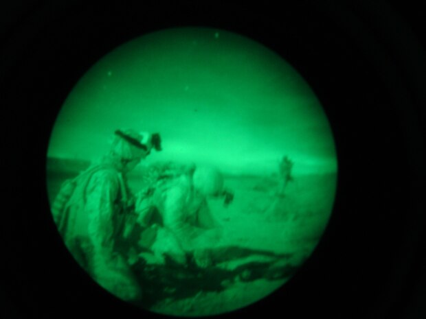 Scout Snipers with Headquarters Company, 1st Battalion, 4th Marines, take part in a night operation Dec. 5. Two teams of snipers have recently taken on duties of a Quick Reactionary Force instead of their usual sniper missions.