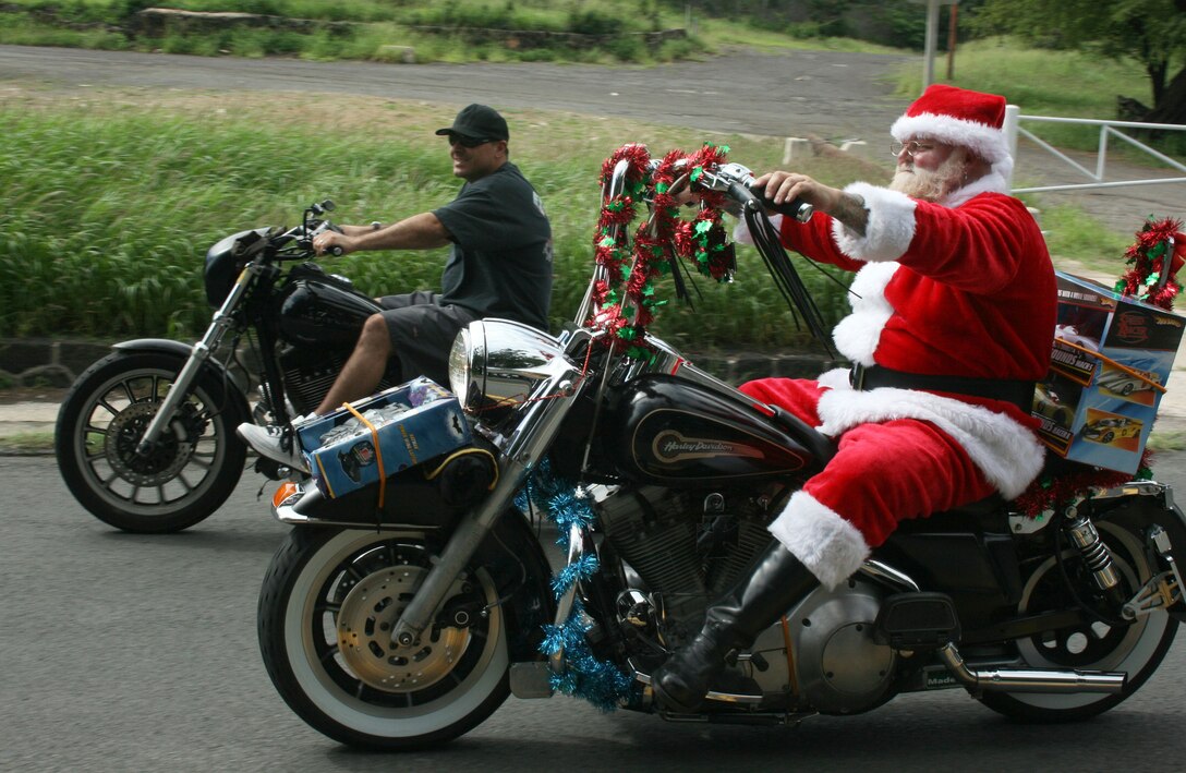 Santa takes off on his motorcycle during the 34th Annual Street Bikers United Toy Run Dec. 7. More than 5,000 motorcyclists from Hawaii and around the world took part in the event and generated thousands of donations to the Marine Corps Reserve's annual Toys for Tots campaign.