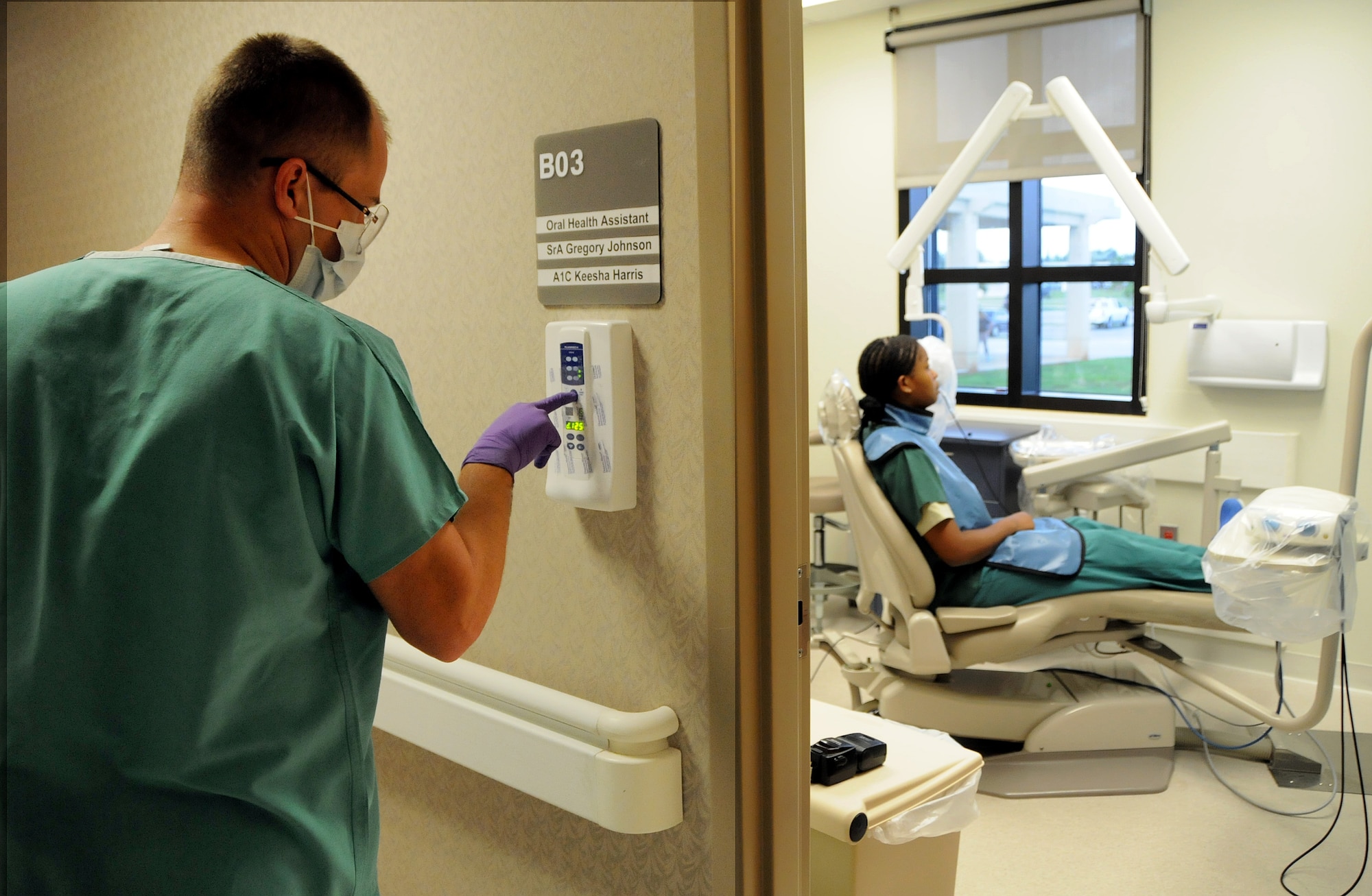 ANDERSEN AIR FORCE BASE, Guam - Capt. Benjamin Hall, 36th Medical Group officer in charge of Dental Radiology, steps out of the exam room as the X-ray is taken here Dec. 5. Within a few seconds, the digital X-ray appeared on the computer screen for review.  (U.S. Air Force photo by Airman 1st Class Courtney Witt)
