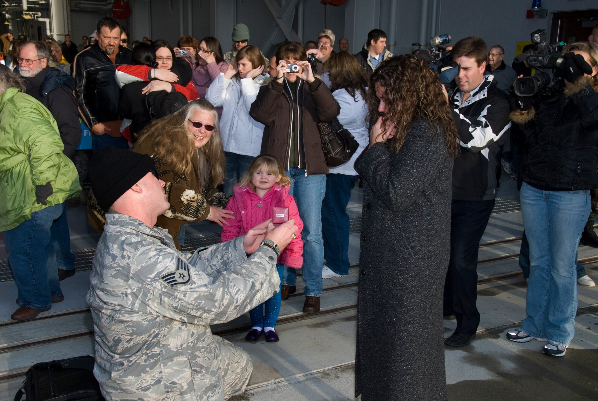 Staff Sgt. Daven Dekok proposes to his girlfriend Tiffany Bauerly upon his return from Eskan Village, Saudi Arabia.
Thirty Two Airmen from the 185th Air Refueling, Security Forces Squadron, Iowa Air National Guard in Sioux City, Iowa, return from a six month deployment on federal active duty, Sunday, December 7, 2008. 
The 185th Security Forces Squadron provided base security at Eskan Village, Saudi Arabia. These Airmen deployed as part of Operations Enduring Freedom, Iraqi Freedom and the Global War on Terror. 
Official Air Force Photo by: SSgt. Oscar M. Sanchez-Alvarez
