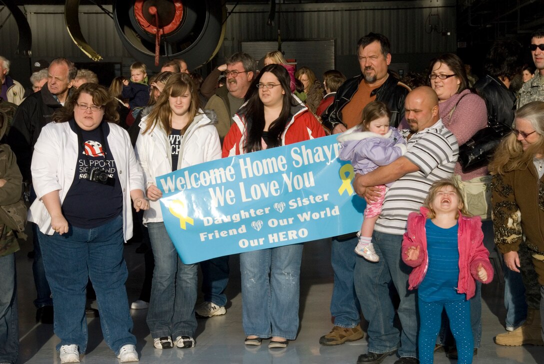 Family members wait in anticipation as the plane carrying their loved ones pulls up in front of the hangar at the 185th Air Refueling Wing (ARW).
Thirty Two Airmen from the 185th ARW, Security Forces Squadron, Iowa Air National Guard in Sioux City, Iowa, return from a six month deployment on federal active duty, Sunday, December 7, 2008. 
The 185th Security Forces Squadron provided base security at Eskan Village, Saudi Arabia. These Airmen deployed as part of Operations Enduring Freedom, Iraqi Freedom and the Global War on Terror. 
Official Air Force Photo by: SSgt. Oscar M. Sanchez-Alvarez
