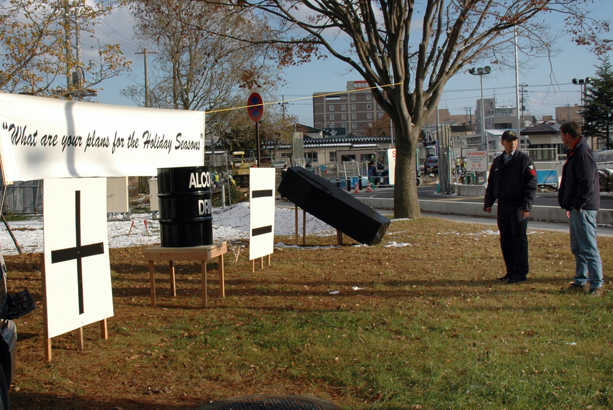 MISAWA AIR BASE, Japan -- Petty Officer 1st Class Harry Turnland, Naval Air Facility Misawa, surveys the new holiday driving under the influence awareness display with Jeffrey Wilson, Naval Air Facility Misawa safety manager, Nov. 20, 2008. The display went up near the Misawa Air Base front gate the day before, as an effort during the holiday season to serve as an added reminder of the consequences of driving after consuming alcohol. Mr. Wilson planned and designed the display, with the support of Misawa Navy and Air Force commanders. (U.S. Navy photo by Chief Petty Officer Brian Naranjo)