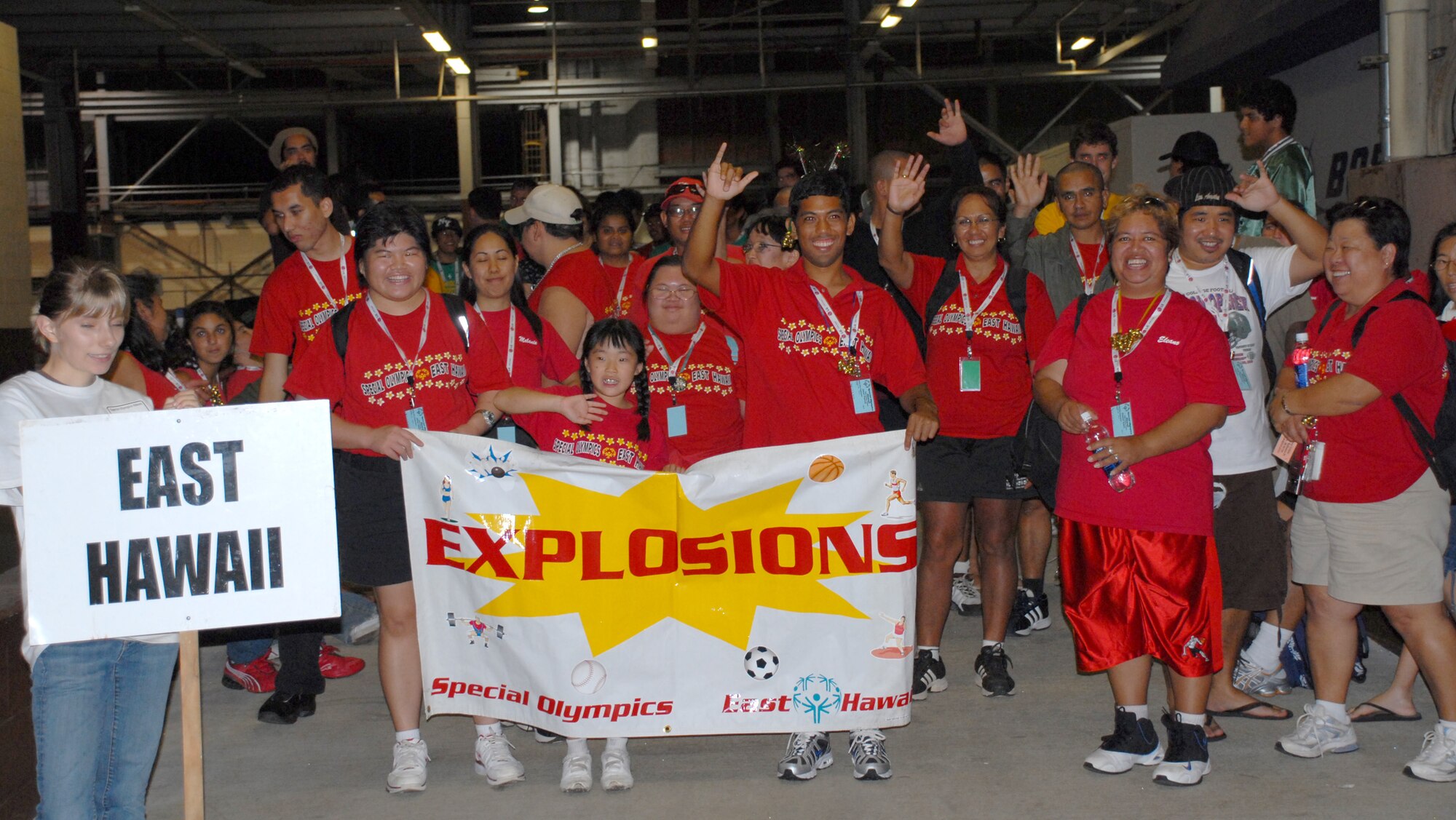 Athletes begin the parade of athletes, kicking off the Special Olympics Holiday Classic Opening Ceremony, Dec. 5 in Hangar 35. The Special Olympics Holiday Classic takes place Dec. 5-7 at Hickam AFB and Marine Corps Base Hawaii Kaneohe Bay. (U.S. Air Force Photo/Staff Sgt. Erin Smith)