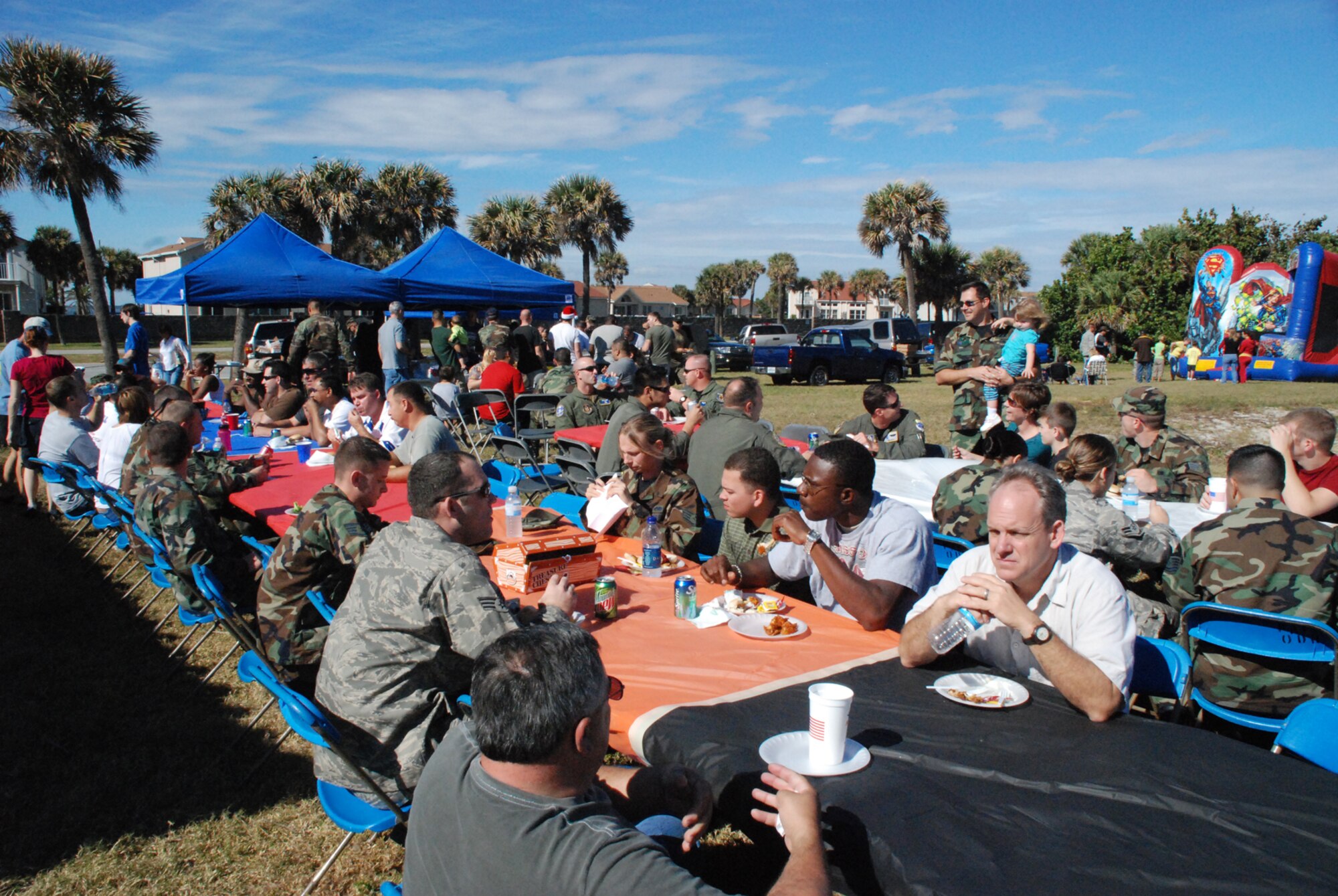 PATRICK AIR FORCE BASE, Fla. -- 920th Rescue Wing members and their families enjoy a picnic and friendship during the unit's annual holiday party December 6 at the north picnic area.  photo/Master Sgt. Bryan Ripple