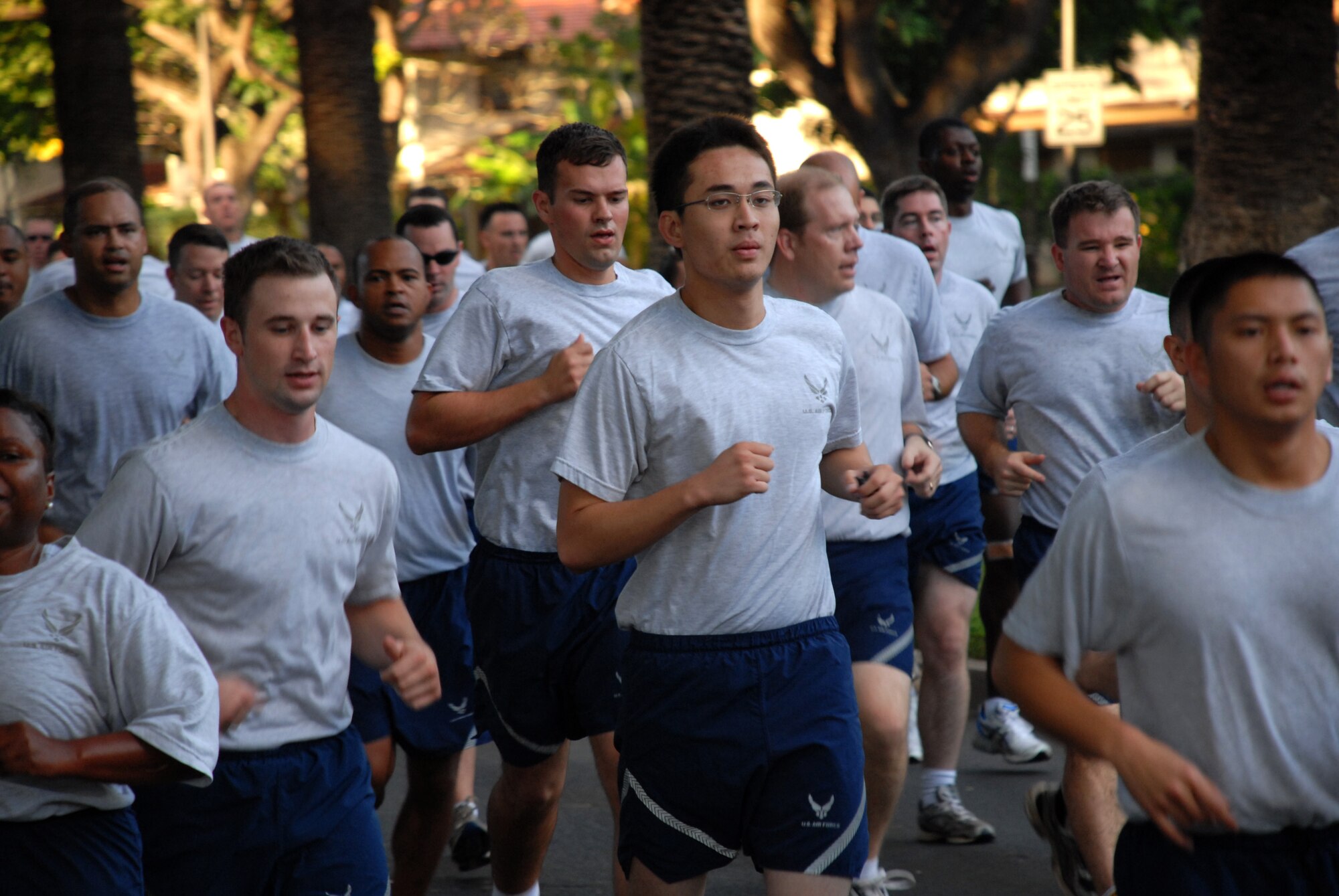 Airmen pass the half-way mark during the Team Hickam monthly warrior run, Dec. 5. The warrior run starts off as a formation run and after the half-way mark, participants can run at their own pace. (U.S. Air Force Photo/Staff Sgt. Erin Smith)