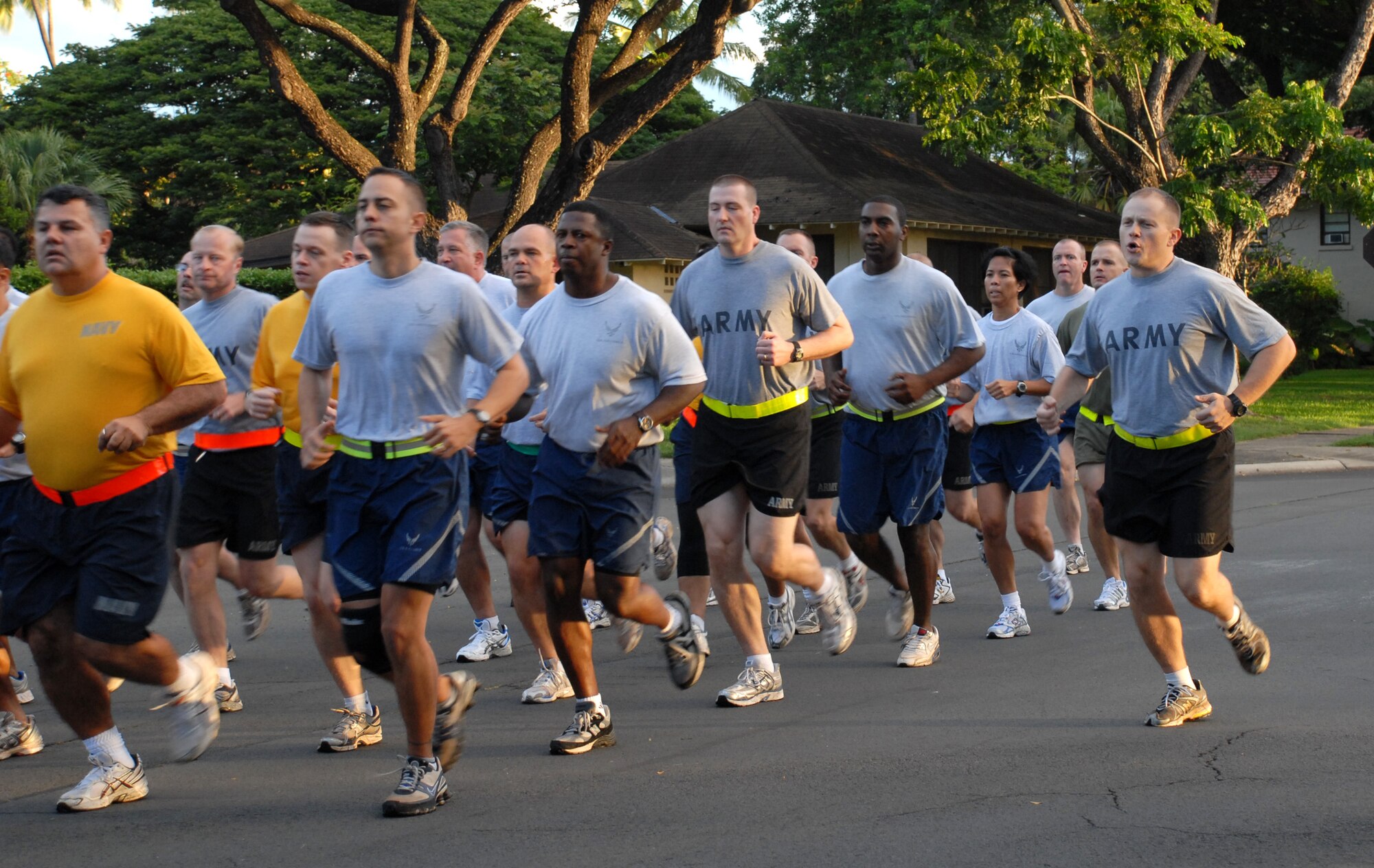 Airmen, Soldiers, Sailors and Marines from Joint Prisoners of War, Missing in Action Accounting Command, participate in the Team Hickam monthly warrior run, Dec. 5. The warrior run is designed to keep members in shape and build teamwork. (U.S. Air Force Photo/Staff Sgt. Erin Smith)