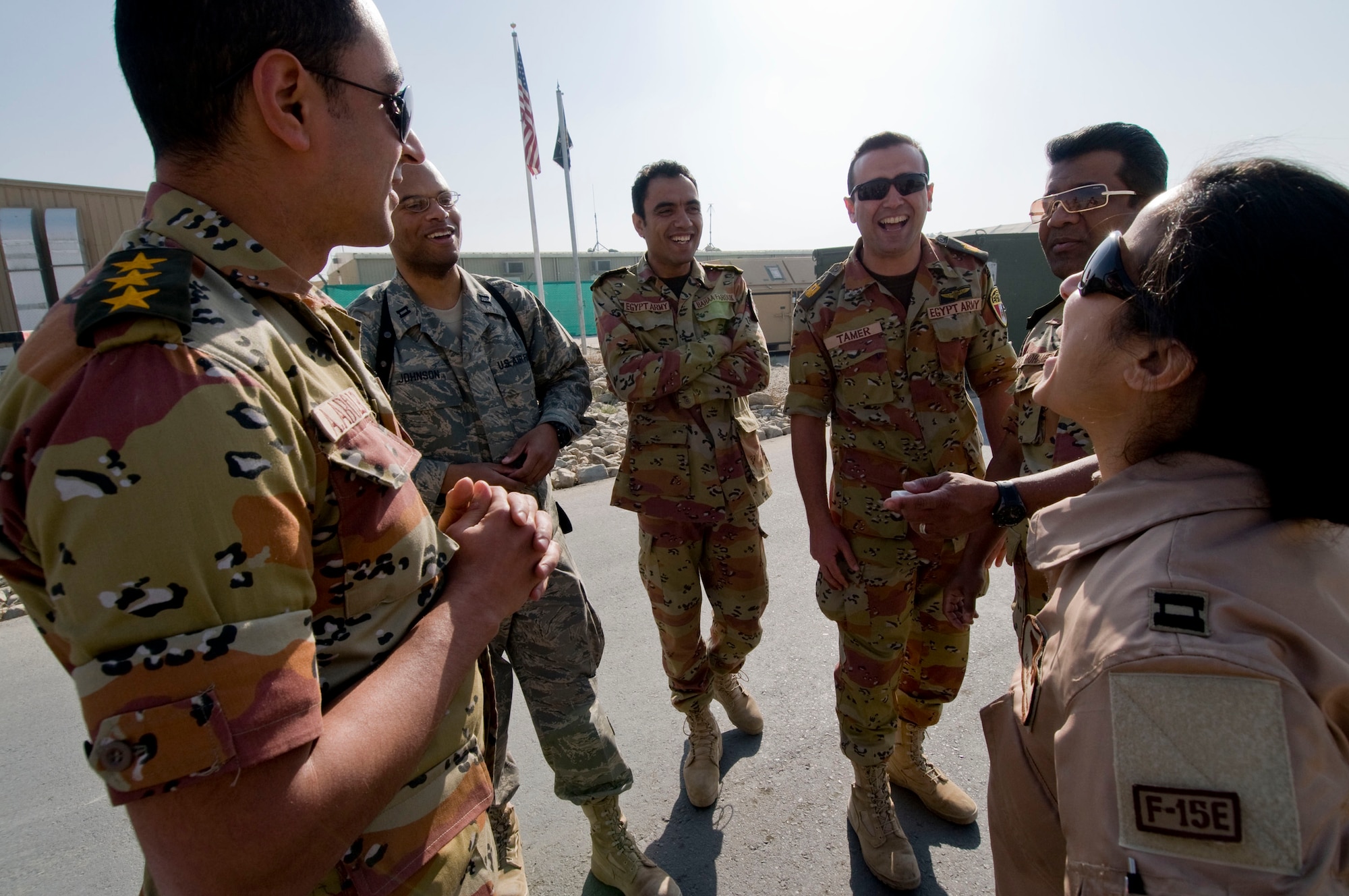 Egyptian doctors laugh with their U.S. Air Force counterparts following a tour of the fighter jets at Bagram Air Field, Afghanistan, Nov. 29. The group exchanged phrases they had learned in each other's languages, often resulting in large amounts of laughter. (U.S. Air Force photo by Staff Sgt. Samuel Morse)(Released)